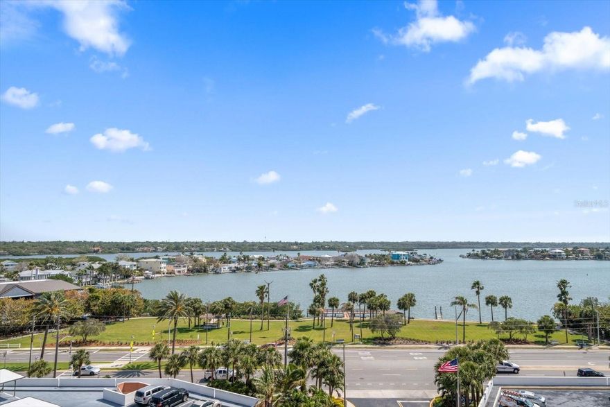 Marvel at the breathtaking vistas of the Intracoastal waterway, the skylines of St. Pete and Tampa, and glimpses of the Gulf! This meticulously updated 2 bedroom, 2 bathroom condo boasts new luxury plank and porcelain tile flooring, along with elegant 5" baseboards. The open kitchen showcases exquisite honed Montecristo Quartzsite countertops, a huge island and bar seating, Kraftmaid custom cabinets, and translucent phantom grey Kitchen Aid appliances. The bathrooms exude luxury with polished marble finishes, glass-enclosed showers, and custom Robern mirror medicine cabinets. Recent upgrades include a brand new 50-gallon water heater and an approximately 5-year-old A/C unit. Situated within the prestigious Redington Towers community, residents enjoy access to a Gulf-front swimming pool, an on-site gym, and outdoor BBQ facilities. Covered and assigned parking complete with electric vehicle charging stations, provides convenience, while a storage closet and 24-hour security guard offer peace of mind. Delight in the proximity to numerous restaurants and shops, with the serene Del Bello Park just across Gulf Boulevard. For endless relaxation, the white sandy beach is mere steps away, beckoning you for year-round enjoyment. With an array of amenities and unparalleled surroundings, this condo offers the opportunity to live where others vacation!