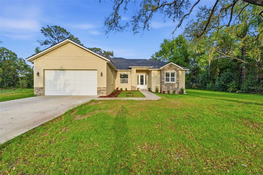 Discover this brand-new, bank-owned construction in DeBary offering modern style and spacious living on over half an acre! This 3-bedroom + den home boasts more than 1,900 square feet of thoughtfully designed space with a desirable split floor plan. Step inside to find luxury vinyl plank flooring throughout the main living areas and cozy carpet in the bedrooms. The open-concept kitchen and living room combination is perfect for entertaining, featuring contemporary finishes, shaker-style cabinets, granite countertops, and stainless steel appliances. A large sliding glass door fills the living space with natural light and leads to a covered porch—ideal for relaxing or hosting guests. The private primary suite offers a true retreat with a garden tub, walk-in shower, dual vanities, and a spacious walk-in closet. Additional highlights include an indoor laundry room and a versatile den perfect for a home office or flex space. Situated on over half an acre, this property provides ample room to add a pool, workshop, or create your dream outdoor oasis. Don’t miss this opportunity to own a move-in-ready home with modern features and room to grow!