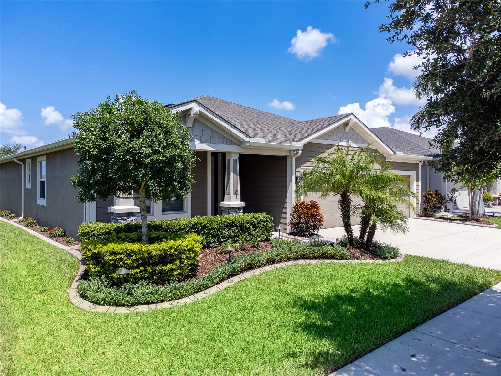 One or more photo(s) has been virtually staged. Welcome to this beautifully appointed Braden Craftsman Model located in the highly desirable Meadowgrove community. This 4-bedroom, 2.5-bathroom home offers the perfect blend of style, space, and functionality. Enjoy the convenience of a 3-car garage, providing ample room for vehicles, storage, or a workshop. Step inside to find tile flooring throughout the common areas and bathrooms, creating a seamless and low-maintenance flow throughout the home. As you enter you will find a den to the left perfect for an office or even 5th Bedroom. Directly next to the open concept kitchen is a formal dining area or again space used for an office. Designed with entertaining and everyday comfort in mind, the open-concept living and dining areas lead to an extended screened-in lanai, perfect for relaxing or hosting guests. The upgraded sliding glass doors enhance the indoor-outdoor lifestyle, letting in abundant natural light and offering easy access to your private outdoor retreat. The backyard opens up to a dry retention area allowing for great space between you and the neighbors. All four bedrooms are generously sized, with a spacious primary suite featuring an ensuite bath. The additional half bath adds convenience for guests and busy households. Located just minutes from shopping, dining, and top-rated schools, this Meadowgrove gem offers peaceful suburban living with easy access to everything Valrico has to offer.