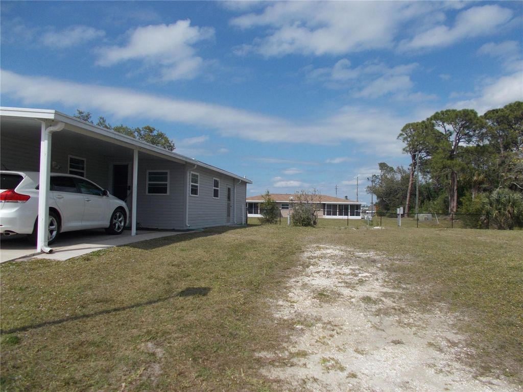 Photo of 5552 Holiday Park Boulevard, North Port, FL 34287 (MLS # C7512953)