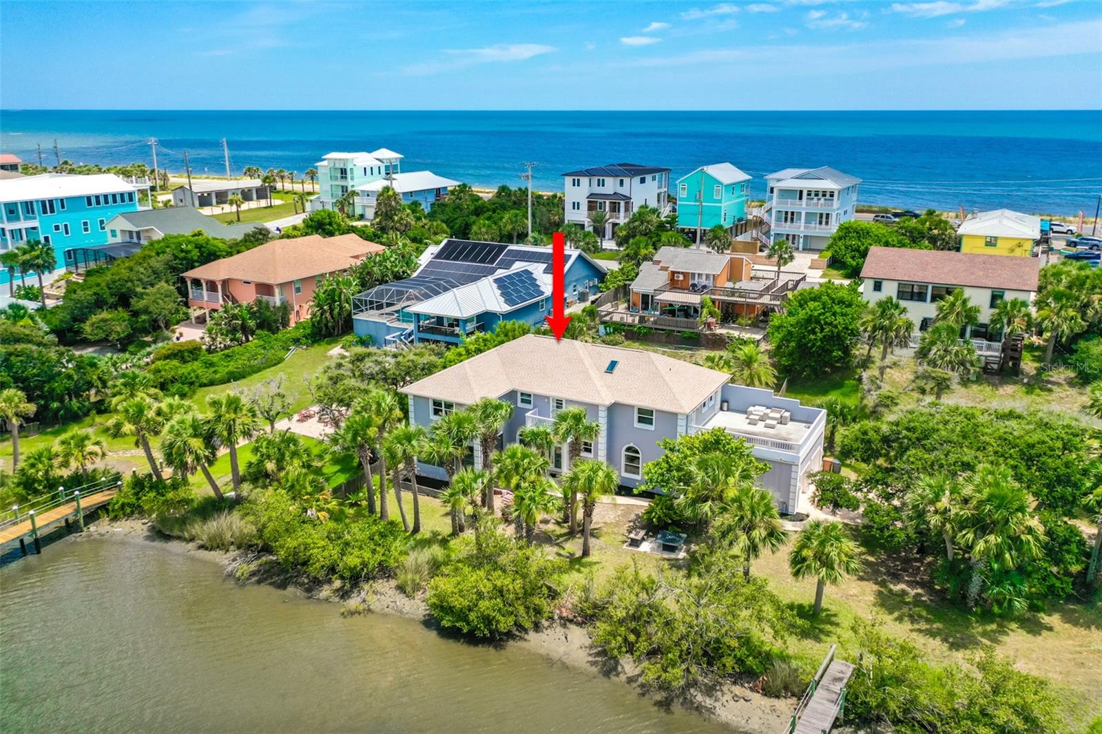 WATERFRONT LEADING TO THE INTRACOASTAL WATERWAY WITH A DOCK! THIS 4-bedroom, 3 1/2 bath HAS 150 feet of water frontage! THE VIEWS ARE BREATHTAKING! This waterfront BEACH HOME is perfect for all your water sports activities. The main floor is filled with natural light, featuring a spacious family room with sliders that lead to a 17 X 9 foot enclosed porch, and a FORMAL dining room ideal for those wonderful holiday gatherings.. THE OPEN Kitchen showcases custom cabinets, stainless steel appliances, and a separate prep sink. Just off the Kitchen, there is a large mud room/Laundry Room (which could be converted into in-law quarters). Additionally, the first floor includes a separate bedroom with its own private bath. The Second Floor features a loft area outside the master suite, complete with a private balcony. The Master suite boasts a cozy sitting area THAT COULD BE AN ADD'L OFFICE SPACE, and a large bath with double sinks, as well as a separate tub and shower. The upstairs also includes a laundry room. The Master Walk-In Closet is spacious enough to accommodate a nursery! The Roof, A/C, and Dock were ALL REPLACED in 2019. THE HOME ALSO HAS A 2ND FLOOR SUN PORCH WHICH ALLOWS FOR THE MOST FANTASTIC SUNSETS IMAGINABLE! THE SELLER HAS STATED THIS HOME HAS NOT FLOODED, All of this is just a 2-minute walk to the stunning beach!