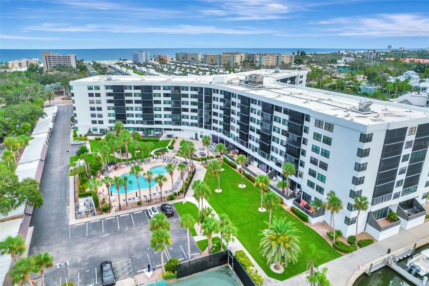 Attention Boaters, Kayakers and Tennis players! Located in the heart of Siesta Key overlooking the Sarasota Little Bay, the Harbor Towers Yach and Racquet Club is a resort-style community offering a long list of amenities including two heated pools, club house with adjacent outdoor grilling patio, state-of-the-art Fitness Center with treadmills, elliptical trainers, free weights, and sauna; Har-Tru Tennis Courts, that are maintained daily, Marina with 40 boat slips available on a first-come, first-served basis, Kayak dry dock with direct launch to intercoastal waters, and Bicycle storage. The complex backs to an intercoastal canal where you can enjoy sitting on benches or relaxing in the shade of Gazebo enjoying water views. Residents also enjoy complimentary access to the Siesta Key Open Air Trolley, making it easy to explore the island, with easy access to the world-famous Siesta Key beach with its quartz sand and stunning sunsets, as well as the Siesta Key Village, offering an array of boutique shopping and dining options. The building just underwent full renovation, including new stucco, new impact glass windows and sliding doors. This 1 bedroom, 1 bath unit located on 3rd floor with elevators is being offered turnkey furnished. It was updated a few years ago and the owner recently put up new vinyl flooring and new closet doors. The spacious living area and the glass and screen enclosed balcony offers partial views of the intracoastal waterway, and the apartment features a plenty of closet space (2 hallway closets and 2 closets in the bedroom), plus the lockable storage space outside of the unit on the same floor. You may enjoy this property for personal use and/or take advantage of the 2-week rental policy to generate income. If you decide to rent, you can take do it on your own or utilize HT onsite rental office. Rental history of this unit is available. Come to experience living in paradise! This complex was just featured in local newspaper!