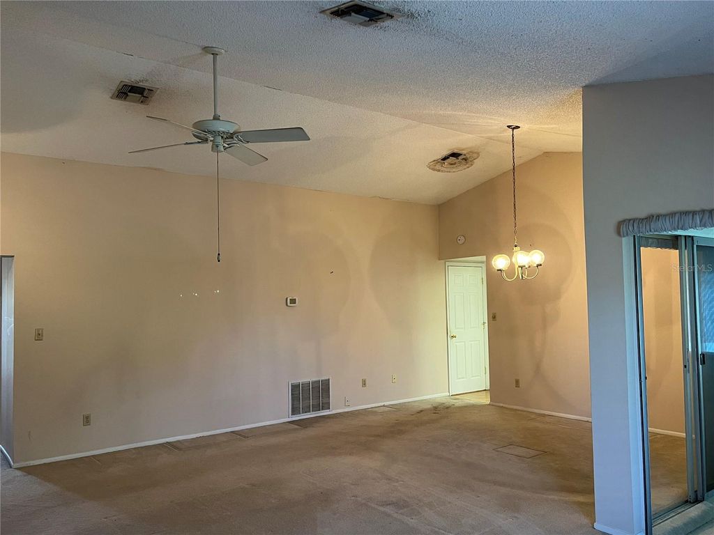Photo of 10738 Lazy Lake Dr, Orlando, FL 32821 (MLS # G5113590)