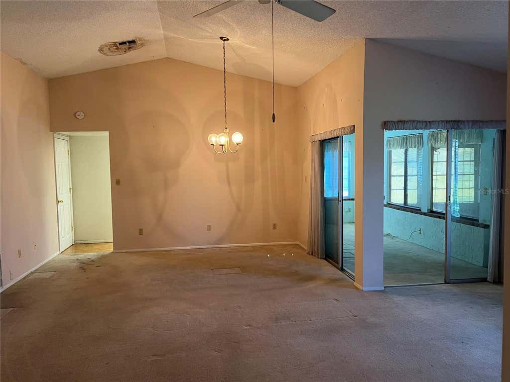 Photo of 10738 Lazy Lake Dr, Orlando, FL 32821 (MLS # G5113590)