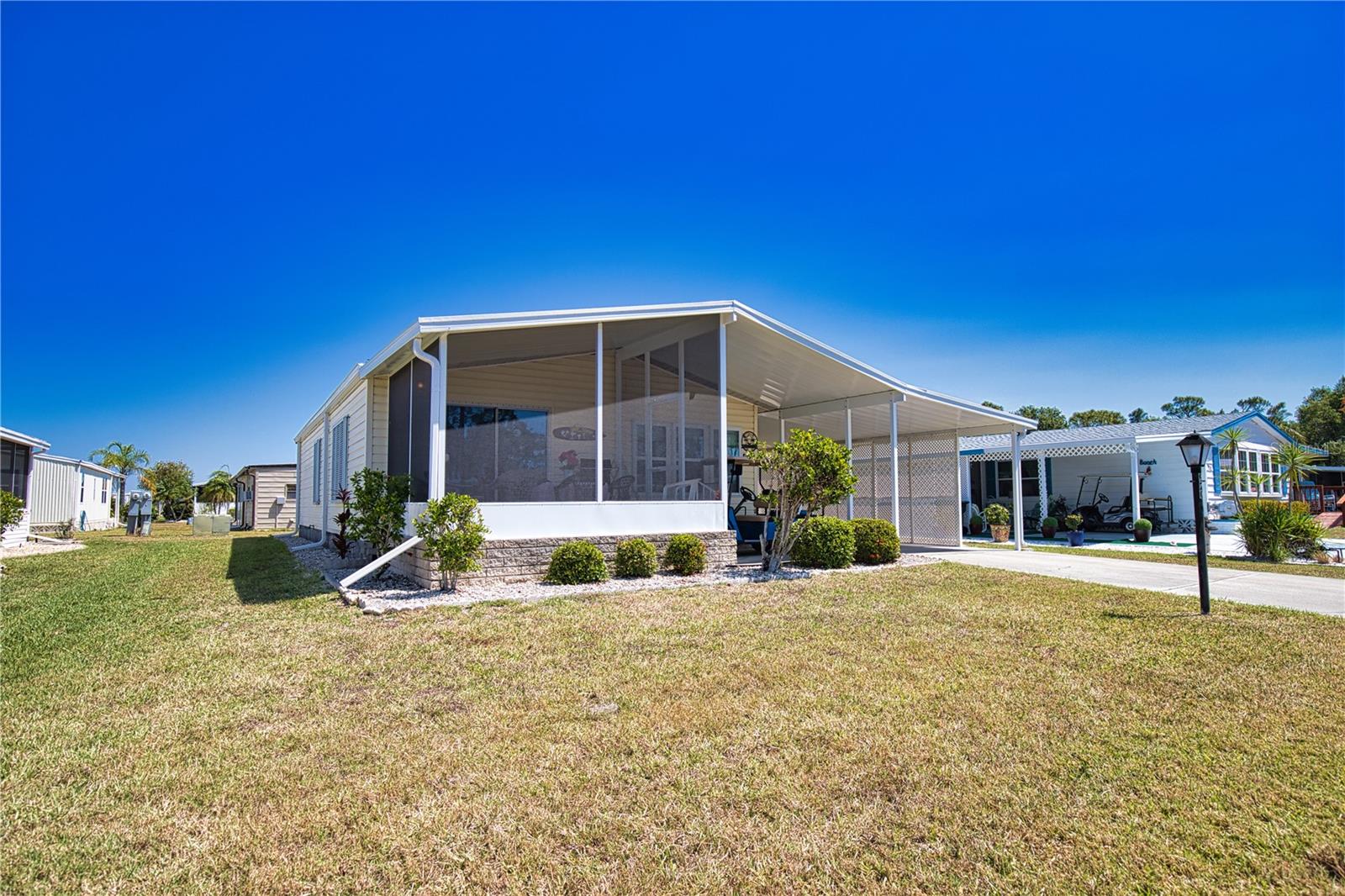 Come and discover this charming 2-bedroom, 2-bathroom home, where some of the high-priced upgrades have already been completed. Currently used as a rental, this delightful property is perfect for a cozy vacation retreat or as an income-generating investment. Recent enhancements include a brand-new shingle roof, a modern HVAC system, upgraded windows, beautifully refreshed landscaping, and newly installed gutters and downspouts. The Lanai and carport were replaced in January 2025. Don't miss the opportunity to make this gem your own! Welcome to La Casa, an enchanting community where 974 exquisite homes are beautifully set among native trees, surrounded by spacious common areas and eight serene lakes. Our generous 60 by 80-foot lots offer your ideal space. Perfectly located between Sarasota and Fort Myers, La Casa is a boater's paradise with direct access to the stunning Gulf of Mexico. Enjoy easy access to shopping, sightseeing, golfing, and fishing, all while immersing yourself in the rich culture of Southwest Florida. Experience the warmth of Southwest Florida’s winters in a relaxed environment, far from the east coast hustle. Our lush, mature landscaping reflects the dedicated care of residents and management. La Casa features some of the finest pools in the area, including our magnificent 40 by 60-foot swimming pool, maintained at a delightful 87 degrees, and a cozy 20 by 40-foot pool nestled between the clubhouse and Activity Building, both with inviting hot tubs. Stay connected with our complimentary Wi-Fi at the Clubhouse, Activity Building, and Recreation Hall while you soak up the sun. La Casa is a family-friendly haven where you can enjoy tranquility while remaining close to vibrant attractions. Come visit our charming oasis and discover why La Casa is the ultimate destination for snowbirds and year-round residents!
