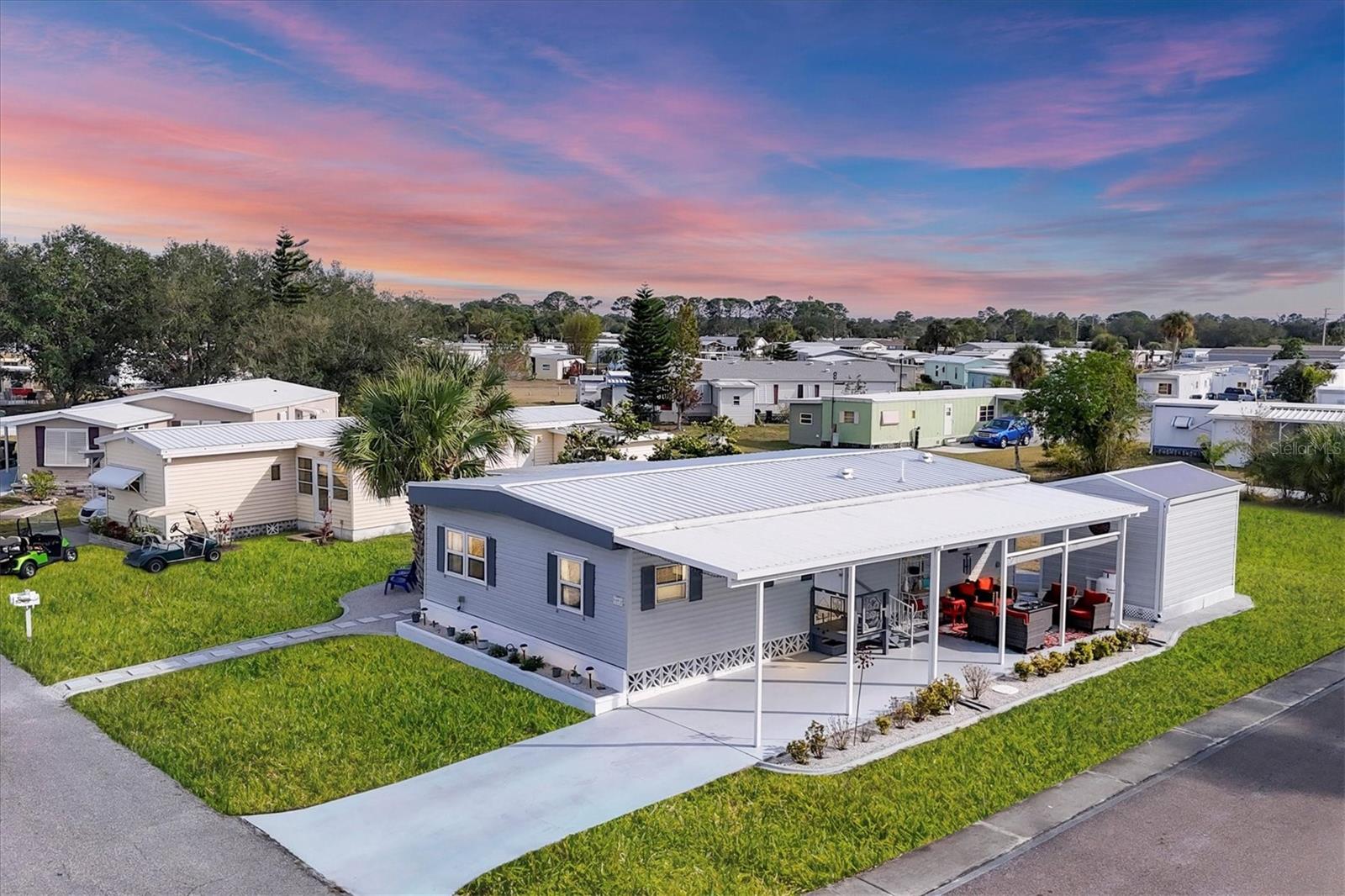 PRICE TO SELL!!!
Holiday Park: A 55+ GATED COMMUNITY. CORNER LOT IN A CUL-DE-SAC WITH 2 BEDROOMS, 2 BATHROOMS.
Public water and public sewer!
METAL ROOF 12/2022, replaced all roof insulation (R40), NEW VAPOR BARRIER, NEW INSULATED CARPORT (wind-rated Florida) 1/2023, NEW FLOORING, UPGRADED KITCHEN, UPGRADED BOTH BATHROOMS, NEW HVAC, and repair duckwork. New ceilings 1/2023, NEW UNDER-HOUSE AND VAPOR BARRIER, NEW SHED 12/2022, NEW LANDSCAPING 3/2023, NEW A/C IN 2020, ELECTRIC UPDATED IN 2017, NEW STAINLESS APPLIANCES, PROPANE RANGE, CEILING FANS, WAINSCOTING, FRESHLY PAINTED, VINYL SIDING, AND ENCLOSED FLORIDA ROOM.
Holiday Park is a gated, secure, and safe 55+ community.
Amenities at the park include: Clubhouse 2 heated swimming pools Tennis courts Pickleball courts Bocce ball courts Horseshoe pits Billiards tables Exercise room with quality equipment Park Library arts and crafts room.
Gated compounds for RVs, boats, and trailers. CONVENIENT TO CHURCHES, SHOPPING, RESTAURANTS AND NEAR BEACHES. Maintenance fees ARE INCLUDED IN THE PROPERTY TAX BILL.Excellent location, peaceful neighborhood, minutes from I-75 & Tamiami Trail! North Port is the perfect place to call home with a central location to shopping, dining, golfing, entertainment, medical facilities, award-winning beaches, and the Spring Training home of the 2021 World Series Champions, the Atlanta Braves. You don’t want to miss the opportunity to see this incredible home in person. All information deemed reliable, but not guaranteed; buyer to confirm all.Situated in a vibrant and thriving community minutes away from Warm Mineral Springs, this property promises a lifestyle filled with abundant sunshine, natural beauty, and coastal charm. GREAT ELEVATION! Nestled in the heart of North Port, this home benefits from its prime location, offering easy access to an array of amenities and attractions. Discover the nearby pristine Gulf beaches, where you can bask in the sun, partake in water activities, or simply relish the tranquility of the ocean. Embark on nautical adventures from the conveniently located marinas, allowing you to explore the region's captivating waterways and nearby islands. North Port is known for its thriving shopping and dining scene, featuring a diverse range of retail centers, boutiques, and restaurants. Immerse yourself in the vibrant downtown area, boasting charming shops, art galleries, and entertainment venues. The city hosts numerous cultural events, festivals, and community gatherings throughout the year, ensuring there's always something exciting happening. Beyond the city's amenities, this home offers proximity to breathtaking nature parks and preserves. Lose yourself in the beauty of Charlotte Harbor Preserve State Park, where scenic trails, wildlife sightings, and peaceful waterways await exploration.Nature enthusiasts will find endless opportunities to connect with the outdoors just moments away from this property. North Port also boasts excellent educational institutions, reliable medical facilities, and convenient transportation options. The city's welcoming community and strong sense of belonging make it an ideal place to establish roots and create lasting memories. Experience the best Florida living, with nearby beaches, golf courses, and outdoor recreational activities just a short drive away. Don't miss out on the chance to own this extraordinary home.