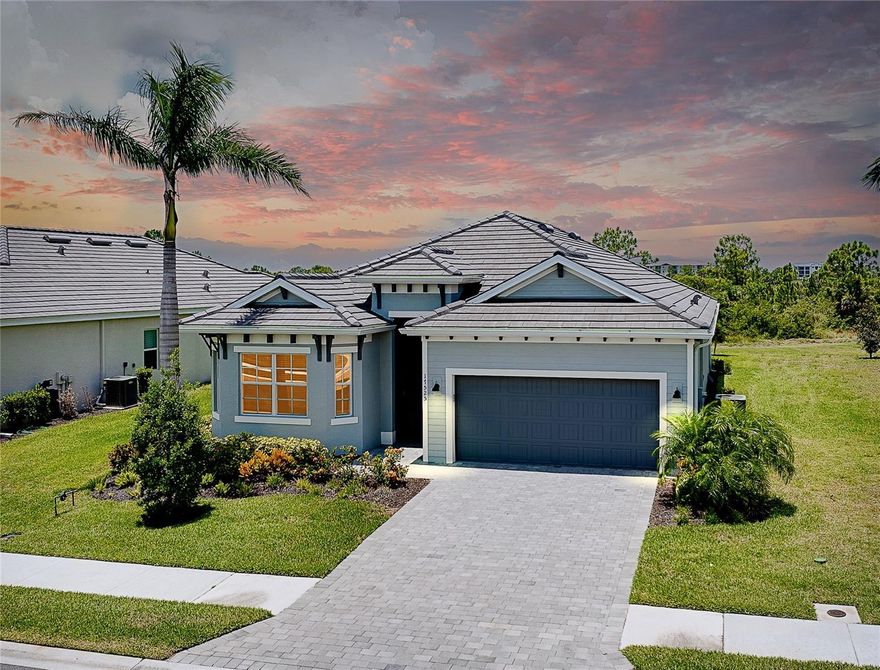 Welcome to this absolutely stunning home that includes full golf memberships-the builder is now sold out of single-family golf membership homes! Perfectly situated on a gorgeous private lot backing to a peaceful preserve, this home offers incredible sunset views from the lanai and is designed for both relaxation and entertaining. The lanai features an outdoor kitchen that has a built-in grill and refrigerator, plus a unique walk-up window bar from the indoor kitchen to the lanai, making hosting effortless and fun. Step inside and you will love the light and bright interior with plenty of windows, large kitchen with a beautiful quartz countertop island, high ceilings, decorative trays and an open split floor plan that ensures you and your guest privacy. The great room and primary bedroom both feature sliding glass doors that lead out to the spacious lanai, seamlessly blending indoor and outdoor living. Additional special features include beautiful custom built-in cabinetry in the great room, built-in cabinets in laundry room with upgraded faucet, custom curtains, backsplash, decorative lighting and fans, hurricane impact windows and doors, reverse osmosis water system in kitchen, insulated garage door, rain gutters, and so much more! Located in Wellen Park's most sought-after gated golf community, residents enjoy an unbeatable lifestyle:golf, resort style pool, tiki bar, pickelball, clay tennis courts, bocce ball, fitness center, salon/spa, and a vibrant calendar of organized social events. Just a golf cart ride away is Cool Today Stadium (home of Brave's spring training), grocery store, and downtown Welllen Park for resturants and shopping. All of this and close to beautiful Florida beaches! This home is a must see! Schedule your showing today!