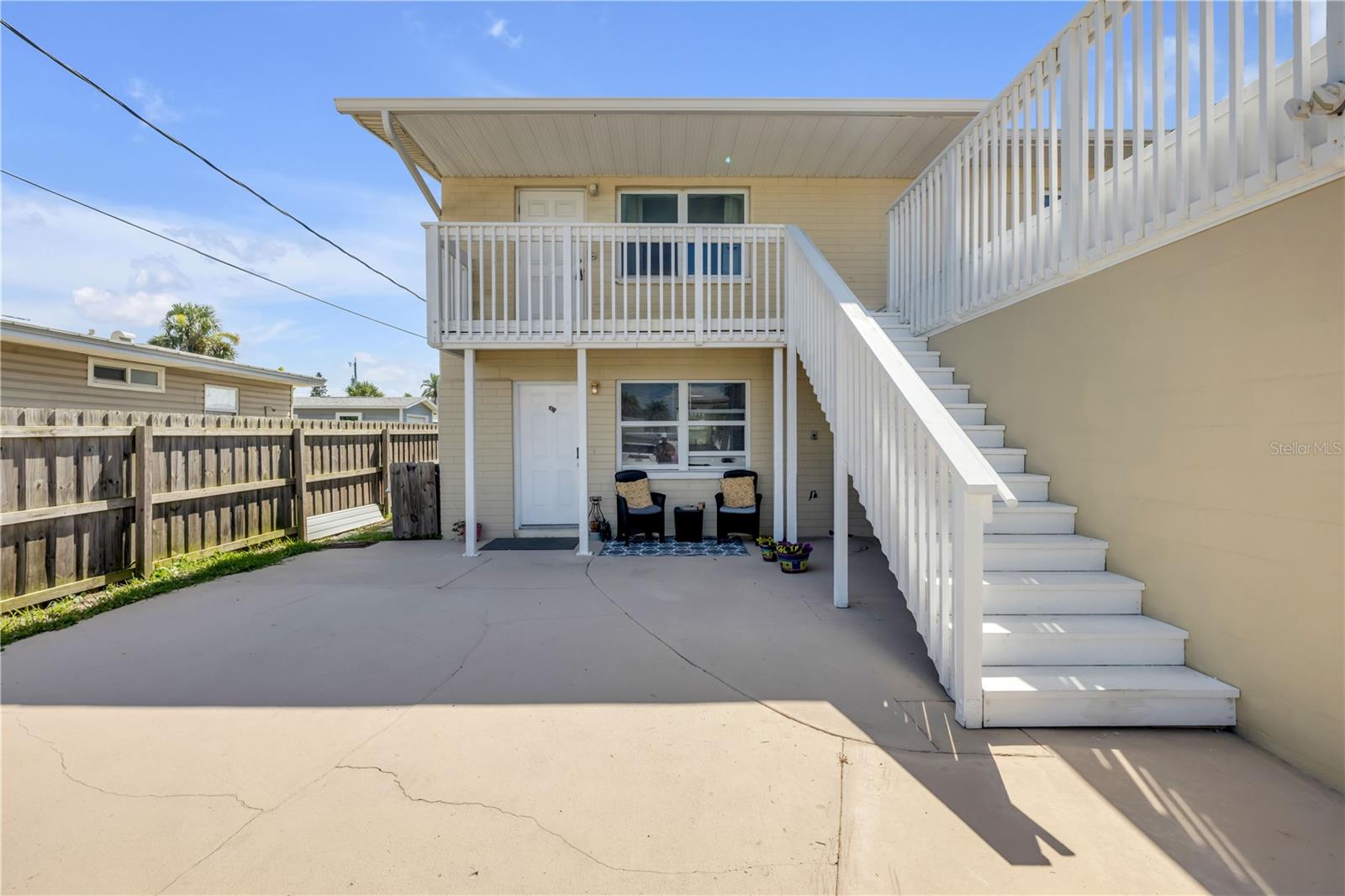 Opportunity awaits just steps from the sand, this beachside duplex is perfectly located on A1A directly across from the ocean in New Smyrna Beach. The lower unit offers a spacious 2-bedroom, 2-bath layout with an open floor plan, a new kitchen, vinyl flooring and interior paint throughout. The upper unit is a bright 2-bedroom, 1-bath featuring brand new flooring, fresh interior paint, and a private deck with beautiful ocean views. Recent upgrades include a new roof, new HVAC systems, and new water heaters, offering peace of mind and low-maintenance ownership. Ideal as a short-term rental, second home, or investment property, this duplex offers incredible flexibility and income potential—all in one of the most desirable coastal locations in New Smyrna Beach. Whether you're looking to generate income or create your own beachside getaway, this is an opportunity you don't want to miss. Call to schedule your private tour today.