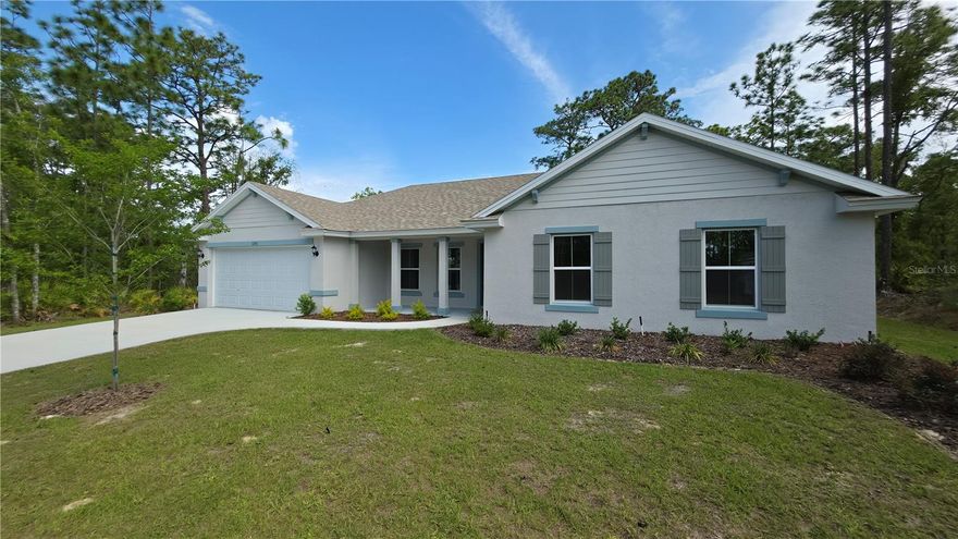 WOW! Welcome to 1353 W Cary Drive, a beautifully built new construction Myrtle model tucked away on a quiet street in the heart of Citrus Springs. This thoughtfully designed 3-bedroom, 2-bath, 2-car garage home offers upgraded finishes throughout, combining quality craftsmanship, everyday functionality, and the peace of mind of a 10-year structural builder warranty.

Step inside to an open and inviting layout featuring luxury vinyl plank flooring throughout the main living areas, kitchen, bathrooms, and laundry room, while the bedrooms offer plush high-end carpet for added comfort. The kitchen is both stylish and functional with granite countertops, a large center island, soft-close solid wood cabinetry, stainless steel GE appliances including range, microwave, dishwasher, garbage disposal, and plenty of workspace for cooking and entertaining.

The roomy primary suite offers a cozy private retreat, complete with a double vanity bathroom featuring granite countertops and a beautifully finished floor-to-ceiling ceramic tile walk-in shower that creates a true high-end feel. The two guest bedrooms provide plenty of space and comfort for family, visitors, or a home office setup, while the guest bathroom carries the same quality finishes with granite countertops and a matching floor-to-ceiling tiled shower, giving the entire home a polished and consistent design throughout.

Sliding glass doors lead to an extended rear patio and a spacious backyard with plenty of room for outdoor dining, entertaining, pets, gardening, or simply enjoying the quiet surroundings. The covered front porch adds even more charm and creates a welcoming first impression from the moment you arrive.

Additional features include a garage door opener, attic stair pull-down, two ceiling fans, and a full irrigation system to help keep the lawn looking its best year-round.

Located in beautiful Citrus Springs, you’ll enjoy nearby walking and biking trails, the natural beauty of Rainbow Springs just 15 minutes away for swimming and kayaking, and everyday conveniences like Target, Walmart, restaurants, and shopping only 10 minutes from home. This is Florida living with the perfect balance of comfort, convenience, and quality new construction.