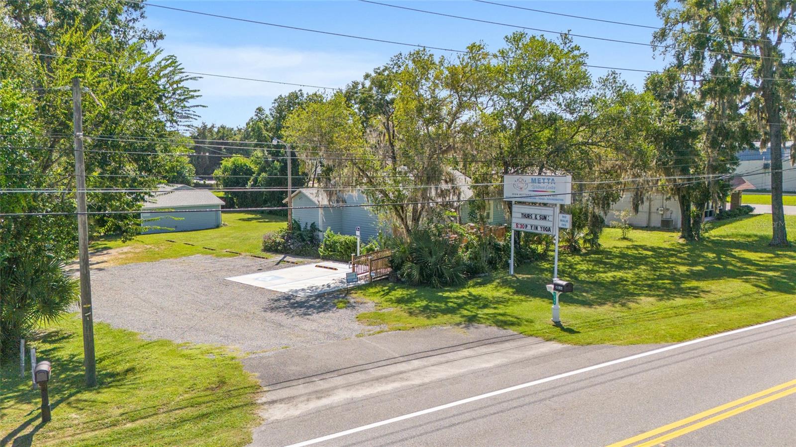 Excellent location, visibility and signage, .53 acre B-2 Commercial Zoning allows for mixed-use for investment or owner user on busy road in fast growing Ocala, Florida. Features two freestanding buildings with flexible office options. The primary building consists of 1,050 sf and is currently used as a Yoga Studio for group classes and transformative workshops. The Yoga Studio offers brand new ADA compliant ramp, wood decking with porch area, two bathrooms, refrigerated filtered bottle filling station and fountain, new flooring, new roof, new batt and blown-in insulation, new HVAC and new on demand hot water heater. Windows have been removed for current use. A separate building consisting of 504 sf, is currently a boutique Massage Therapy Studio, with two treatment rooms, lobby, kitchenette and 1/2 bath (plumbed for shower, could be used as a living space), offers new waterproof flooring, new HVAC, new roof, new instant hot water heater and new closed cell insulation and batt insulation. Additionally there is a 12x32 utility/ storage building, 9-car parking spaces, both buildings are handicap accessible. Well lit signage, 142 feet road frontage. Only 5 minutes North of Downtown Ocala.
