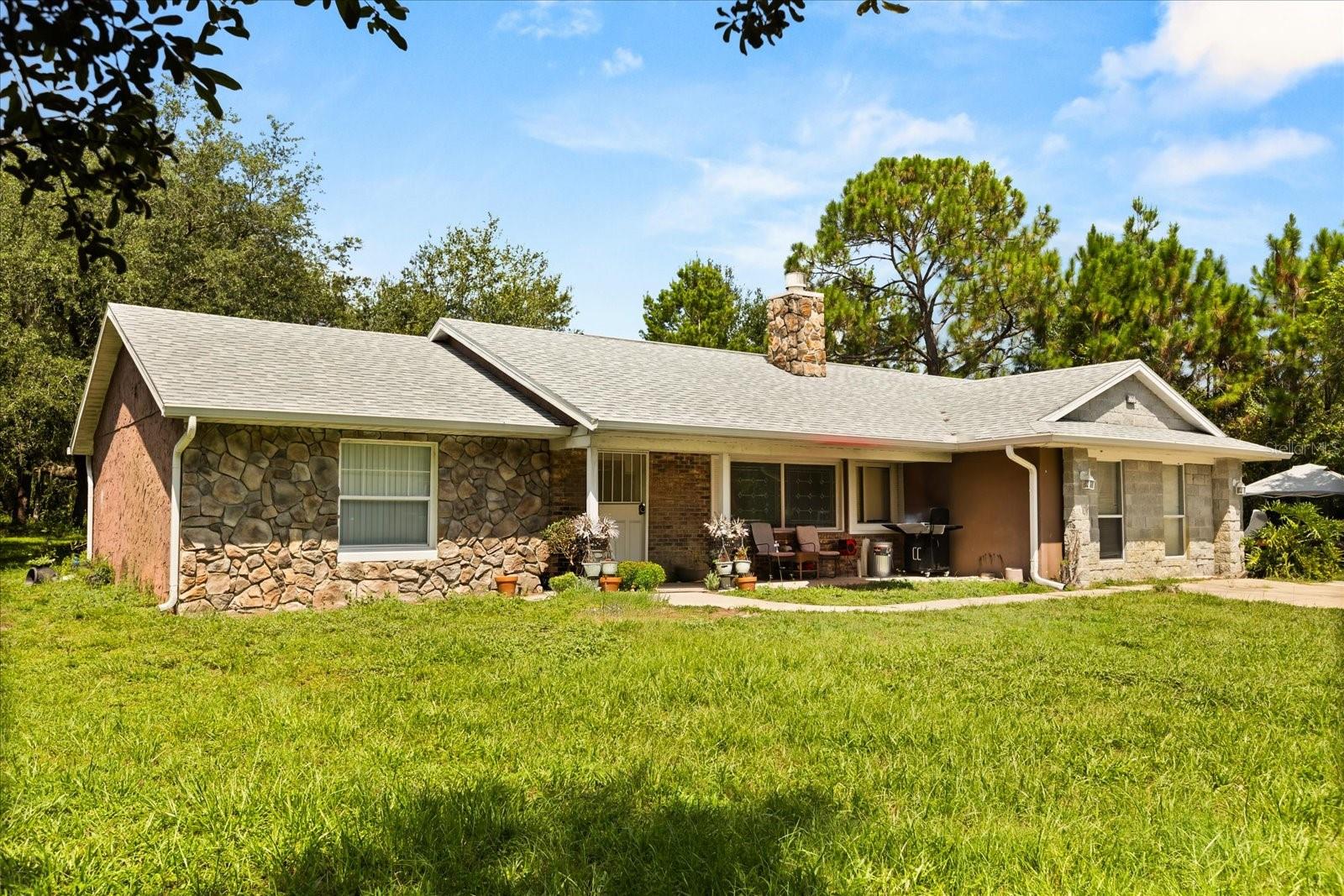 Bring your horses and enjoy the best of both worlds, country living with city convenience! This 2.5-acre fully fenced, high-and-dry property is the perfect Florida retreat.
This property has been very well kept and enjoyed over the years. Have peace of mind with a newer roof (2023) and new AC (2022).
The garage has been tastefully enclosed, seamlessly flowing with the rest of the home, offering extra living space and flexibility. Kids and pets will love having plenty of room to run and play safely within the fully fenced acreage.
A HUGE 34x40 RV carport/pole barn with 220-volt electricity and water is ideal for storage, hobbies, or parking large vehicles. The property also includes a 2-stall stable with a storage room, complete with electric and water, making it ready for horses or livestock. Also on the property is a large paddock area that can be used for pets or livestock.
Whether you’re looking for privacy or space this home delivers. Don’t miss your chance to own this hidden gem, a private country oasis right in the heart of Deltona!
Offering a 2-1 interest rate buydown with our preferred lender!