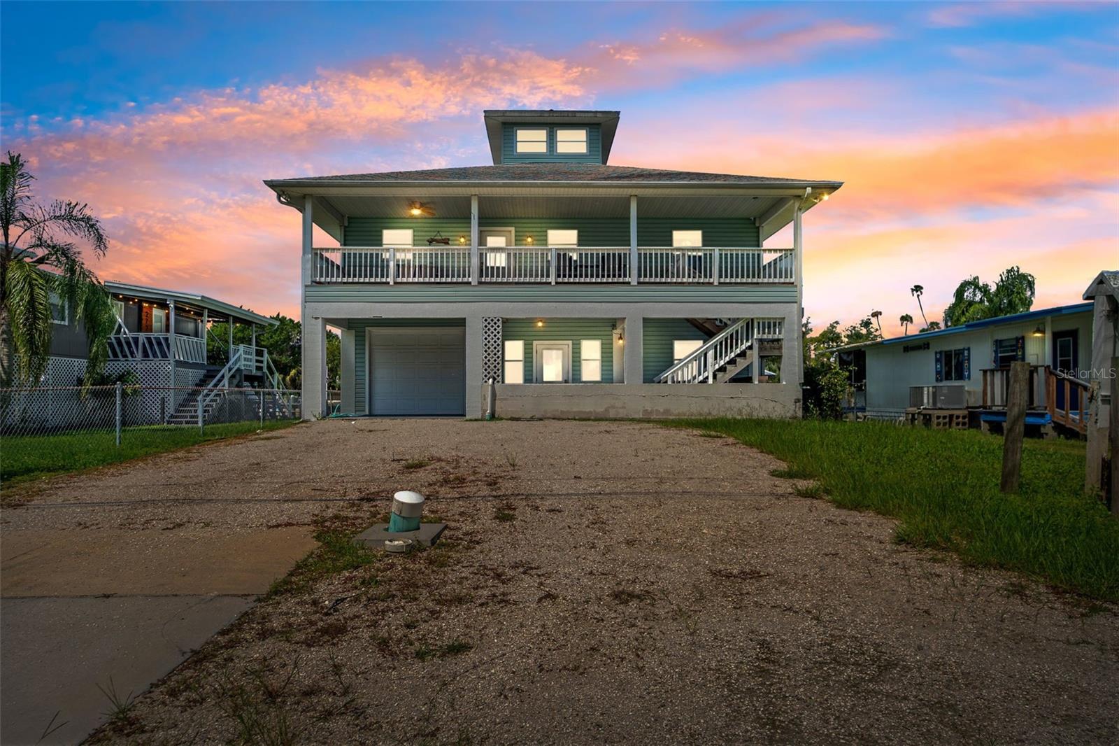 Crystal River Luxury Waterfront Estate – A Three-Story Fully Furnished Retreat on the Deepest Canal! Welcome to a one-of-a-kind waterfront residence in the heart of Crystal River, where strength of construction meets elegance of design, and the Florida waterfront lifestyle unfolds in every direction. This striking three-story home rises gracefully above the deepest canal in Crystal River, offering direct Gulf access with no bridges, no tide restrictions, and room for even the largest vessels. Whether you’re setting out for a deep-sea adventure, enjoying a sunset cruise, or entertaining guests dockside, this home provides a boating lifestyle without compromise. Built for Strength, Designed for Style!
Constructed with fortress-like durability, this residence was engineered for longevity and peace of mind. With R-30 insulation in the walls and roof, 2x6 exterior framing, dual-pane windows, steel-reinforced pilings, and a solar-reflective attic barrier, the home is a masterclass in quality and efficiency. Even the ground-level areas showcase thoughtful utility, featuring 220 wiring, 30-amp motorhome service, and a spacious garage/workshop cooled by dual A/C units. Elegant Interiors & Elevated Living! Step inside to discover a warm and inviting interior where cathedral ceilings create volume and light. The kitchen, adorned with solid wood cabinetry, tile counters, and a casual breakfast bar, opens seamlessly into the main living area—perfect for hosting or relaxing after a day on the water. With two spacious bedrooms and two full baths, the home offers comfortable accommodations, but its true beauty lies in the countless vantage points from which to take in the water views. Perched atop the third story is a charming cupola retreat, a sun-drenched flex space that makes for the perfect home office, artist’s loft, or reading nook with panoramic water vistas. Whether you’re working remotely or simply seeking inspiration, this elevated perch offers unmatched tranquility. Outdoor Living on Every Level! With four expansive 10x40 porches—two upstairs and two downstairs—this residence embraces outdoor living at its finest. Here, mornings begin with coffee on a breezy balcony, afternoons are spent watching dolphins swim by, and evening sunsets that paint the water with shimmering light. A 50-foot private dock complete with fish-cleaning station ensures your days on the water are as effortless as they are memorable. Proven Investment & Lifestyle Opportunity! Currently operated as one of the most successful VRBO rentals in all of Crystal River, this property has a strong income history, generating over $60,000 annually since 2015. Whether you continue its legacy as a proven income producer or reserve it as your own private retreat, the opportunities here are exceptional. A Location That Defines the Florida Dream! Nestled behind 200 feet of secure fencing, this home offers privacy while still placing you in the middle of everything Crystal River is known for: scalloping excursions, world-class fishing, kayaking through spring-fed waters, and unforgettable encounters with the area’s famous manatees. Just minutes to waterfront dining, boutique shops, golf, and the open Gulf, it’s a lifestyle that blends everyday convenience with pure Florida adventure. This home is not only a residence but an opportunity to own one of Crystal River’s most distinctive waterfront properties—a rare blend of enduring construction, timeless design, and world-class location!