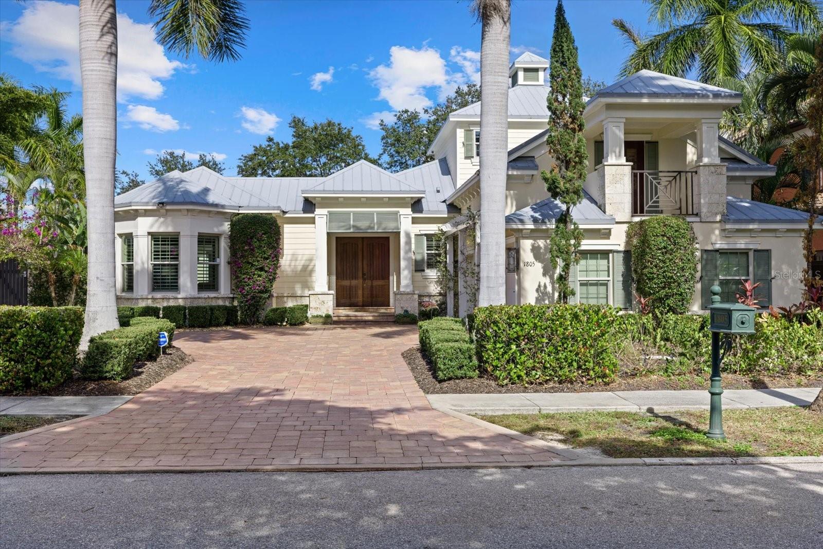**Prime Location** – Just one house from Southside Village featuring highly popular shops and restaurants. Built as a model home by Todd Johnston in 2012, it offers 4 bedrooms, 4.5 bathrooms, an office, and a bonus room in the main house, the 4th bedroom and bathroom is an attached guest suite with a private entrance. The home was thoughtfully designed to embrace Sarasota’s outdoor lifestyle. Featuring an open floor plan, high ceilings, impact doors and windows, wide plank oak floors and thoughtful details throughout. The designer kitchen is centered around an oversized seating island, a natural gas stove, built-in oven, two dishwashers, solid wood cabinets, and stone countertops. Large sliding glass doors flood the interior with natural light and pocket to create a seamless transition to the outdoor courtyard. The spacious covered patio, complete with electric screens and a summer kitchen, provides ample space for both dining and lounging, all while overlooking the walled garden and pool area.The primary suite and separate office are conveniently located on the main level and offers dual walk-in closets, a spa-like bathroom, and direct access to the outdoor courtyard. Upstairs, you’ll find two additional bedrooms plus a bonus room, perfect for a home gym or additional workspace. This home is a perfect blend of location, comfort, and functionality, with an emphasis on Sarasota’s ideal indoor-outdoor living.