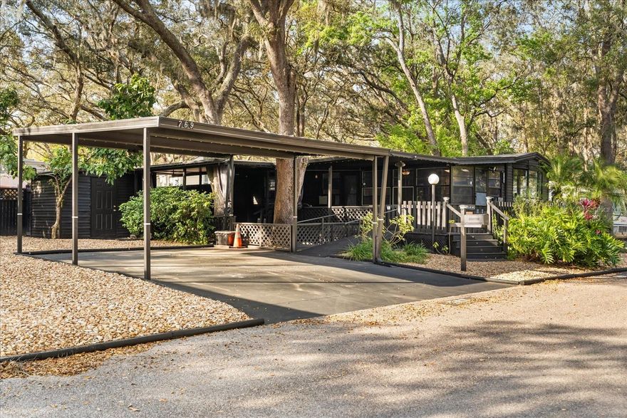 Charming 2-Bedroom Home with Resort-Style Amenities & Investment Potential in Apopka! ???? Discover your own slice of paradise with this charming 2-bedroom, 1-bath manufactured home on owned land in the heart of Apopka! Situated on two separate lots (#767 & #769), this property offers incredible flexibility—build an additional home on the second lot to rent out for extra income or create your own family compound. Step outside to enjoy the expansive L-shaped deck, with 8x25 feet of covered space, perfect for entertaining or relaxing in the shade. A 6x18 foot front porch provides a cozy spot for your morning coffee, while the paver patio with privacy curtains creates a serene outdoor retreat. Customize your ambiance with your own gemstone lighting system for the perfect evening setting. Inside, the home features durable luxury vinyl flooring throughout, new blinds, and a kitchen equipped with stainless steel appliances, including a refrigerator, stove, and range hood. Recent upgrades include a new breaker box for peace of mind and a state-of-the-art security system, with security cameras and a monitoring system included in the larger bedroom for added safety. A 2-car carport provides convenient covered parking. Beyond your doorstep, enjoy access to resort-style HOA amenities, including a swimming pool, kiddie pool, basketball court, playground, shuffleboard, horseshoes, mini golf course, and an on-site country store with a restaurant. This 24-hour virtual gated community also allows short-term rentals, making it an excellent opportunity for investors or those seeking a vacation home. With the ability to develop an additional property, this home offers both a personal retreat and income-generating potential. Don’t miss out on this incredible opportunity! Cash Offers Only. Schedule your showing today and experience the Florida lifestyle at its best!