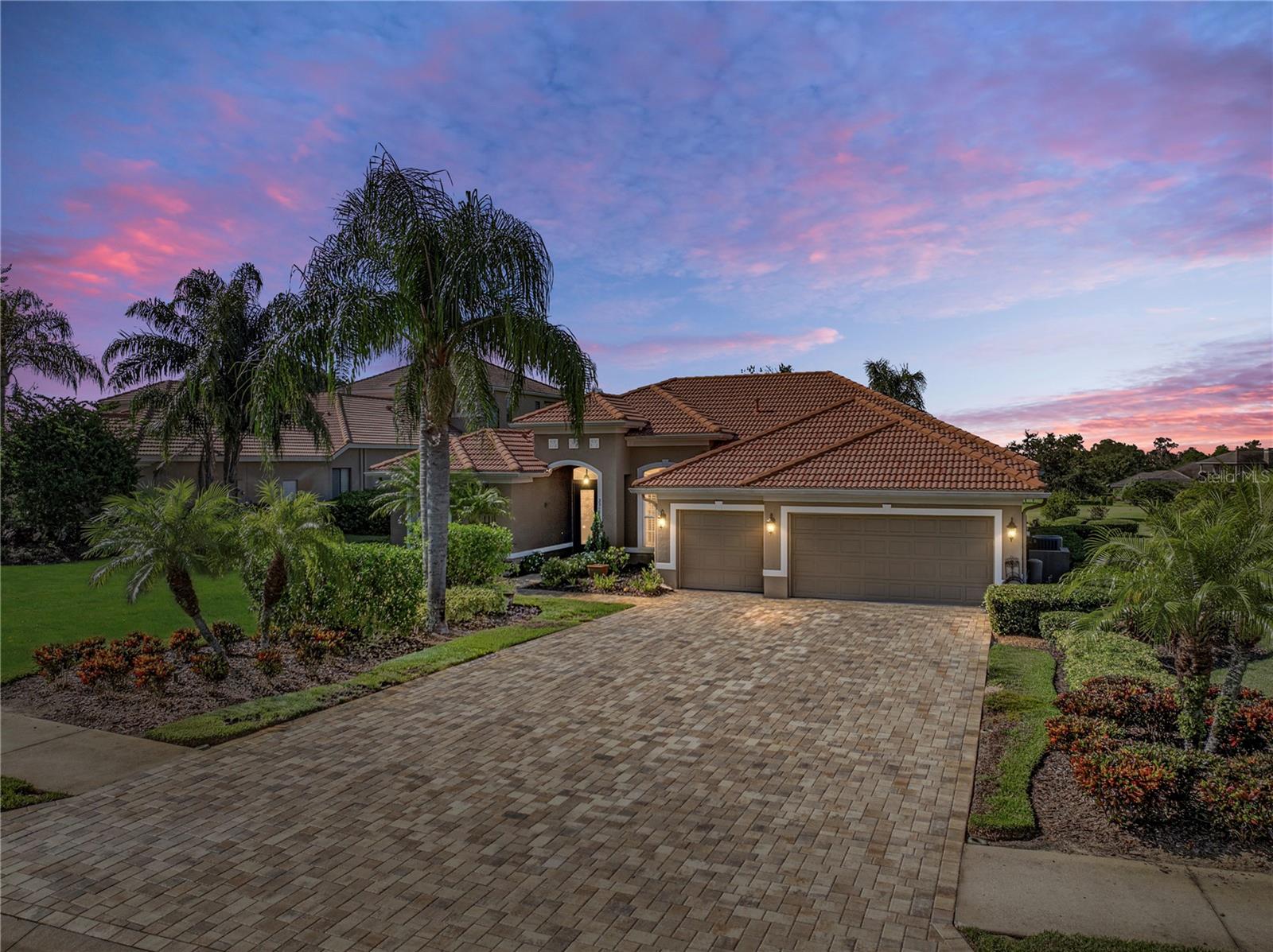 If you are searching for a peaceful yet active lifestyle, the Lake Jovita Golf and Country Club community
is the perfect place for you! This captivating 3 bedroom + office, 3 bath, 3 car garage pool home is ideally
set on a corner lot offering beautiful golf course views, sidewalk lined streets, mature landscaping, a
paver drive, and over 3/4 of an acre of land. Step inside to the formal entertaining areas complete with a
dining room, living room, sliding doors to the pool deck, and easy-to-maintain tile flooring. The heart of
this home is a true delight for culinary enthusiasts, featuring granite countertops, wood cabinetry, an
island with breakfast bar seating, a walk-in pantry, a built-in oven and microwave, a cooktop with a
custom range hood, and updated lighting. It is centrally located with views of the expansive family room
and a buffet bar that sits between the kitchen and the formal dining room for easy entertaining. Privately
split away from the other bedrooms and accessed through double doors, the primary suite is a tranquil
retreat at the end of a long day. Enjoy luxury vinyl plank flooring, 2 large walk-in closets and a spa-like
ensuite bathroom that has dual sinks, a walk-in shower, and a separate soaking tub. Bedrooms 2 + 3 are
on the opposite side of the home and share a full bathroom in-between. The office space is completely
set away from all bedrooms, it has vaulted ceilings and is near the 3rd full bathroom and pool access! The
oversized laundry room, the 3 car garage, and a whole house generator add additional convenience to
this one of a kind property. Take in the views from the relaxing and beautifully designed paver pool deck.
You can soak up the Florida sunshine by this sparkling pool, or relax in your spacious backyard with
stunning views of the surrounding landscape. Whether you're hosting a BBQ or enjoying quiet evenings
under the stars, the outdoor space provides an ideal setting to unwind. Residents of Lake Jovita enjoy an
amenity experience like no other. They have a 24/7 guarded gate, a playground, walking trails, dog park,
and pickleball courts. For a separate fee, even more amenities are offered at the Golf and Country Club
including two championship 18-hole golf courses, a clubhouse with a restaurant, tennis courts, fitness
center, and more! Do not miss your chance to change not only your home, but your lifestyle. Call us
today!