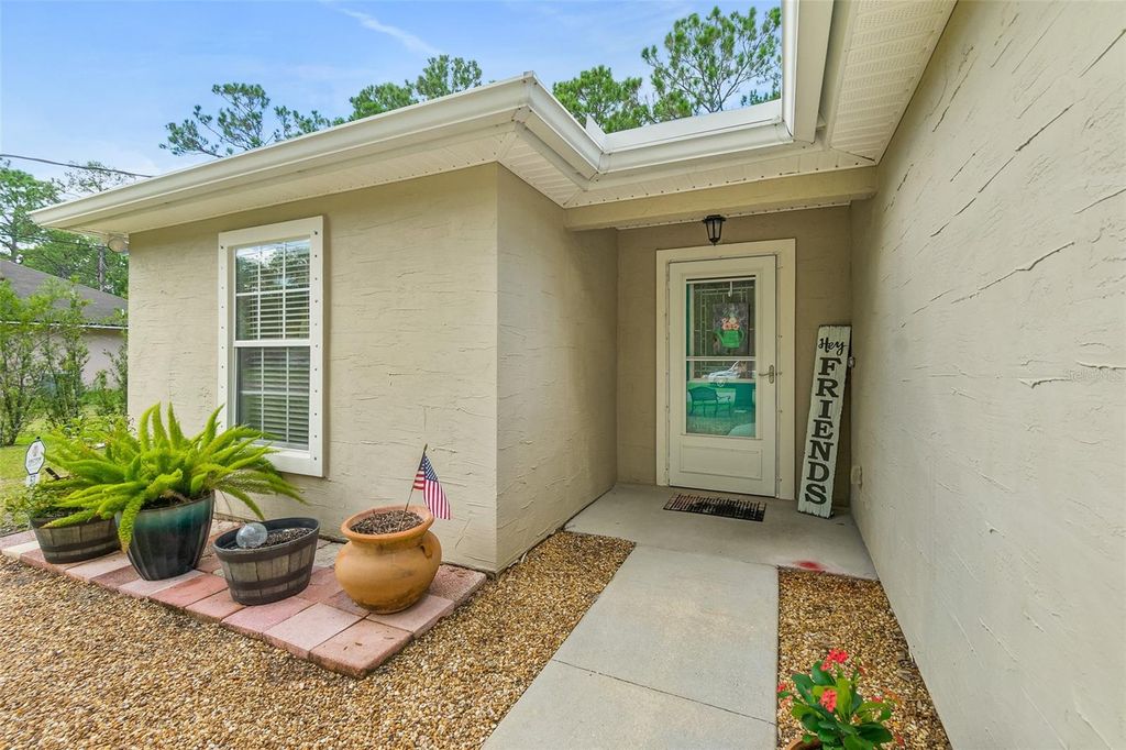 Photo of 57 Sleepy Hollow Trail, Palm Coast, FL 32164 (MLS # FC316941)