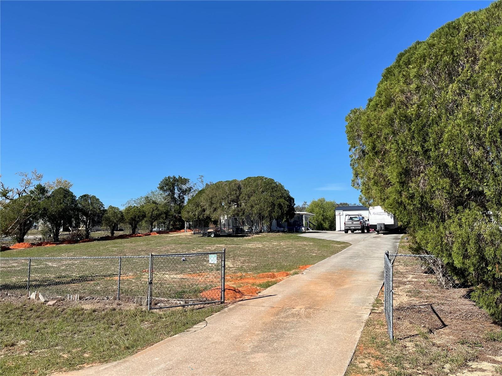 FL living at an affordable price or great investment property! This 3BD/2BA home is situated on 0.92 acres. Short distance to all shopping, schools, medical facilities, and restaurants. Make this your new winter retreat or year around home. Call today, don't miss this great investment opportunity.