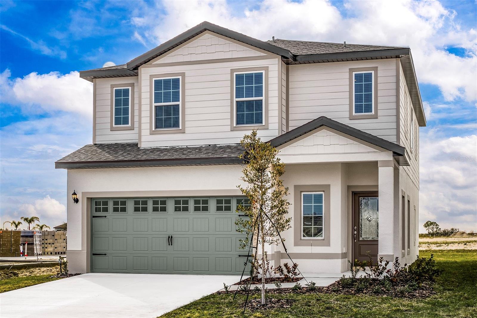 Pre-Construction. To be built. Introducing the Mangrove model at Gum Lake Preserve — a spacious two-story, four-bedroom, two-and-a-half-bath home with a two-car garage and thoughtful design throughout. This home is filled with designer upgrades and offers the perfect amount of space for your family to grow and thrive. Step inside to a grand foyer and discover an open-concept main level with an ideal layout for family gatherings. The kitchen is a true standout, featuring an expansive island with breakfast bar, exceptional counter space, and a generously sized four-shelf pantry to keep everything organized. The kitchen seamlessly flows into the family and dining areas, creating a bright, airy space perfect for entertaining. A sliding glass door leads out to the covered back lanai, blending indoor comfort with outdoor enjoyment.
Upstairs, all four bedrooms are tucked away for extra privacy. The spacious loft is a flexible area that can be transformed into a home office, playroom, or media room. The luxurious master retreat easily fits a king-size bed and includes a large walk-in closet and a spa-inspired bathroom with dual vanities and a walk-in shower.
Outside, enjoy a long covered front porch and beautifully landscaped front yard. Located in the desirable Gum Lake Preserve, residents enjoy access to walking trails, a community gazebo, children’s playground, fishing pier, picnic area, and a public boat ramp. Just minutes from I-4, this peaceful community offers quick access to both Orlando and Tampa, making it ideal for commuters and nature lovers alike!
Don't miss out on this incredible home in a community full of amenities! Schedule your tour today!