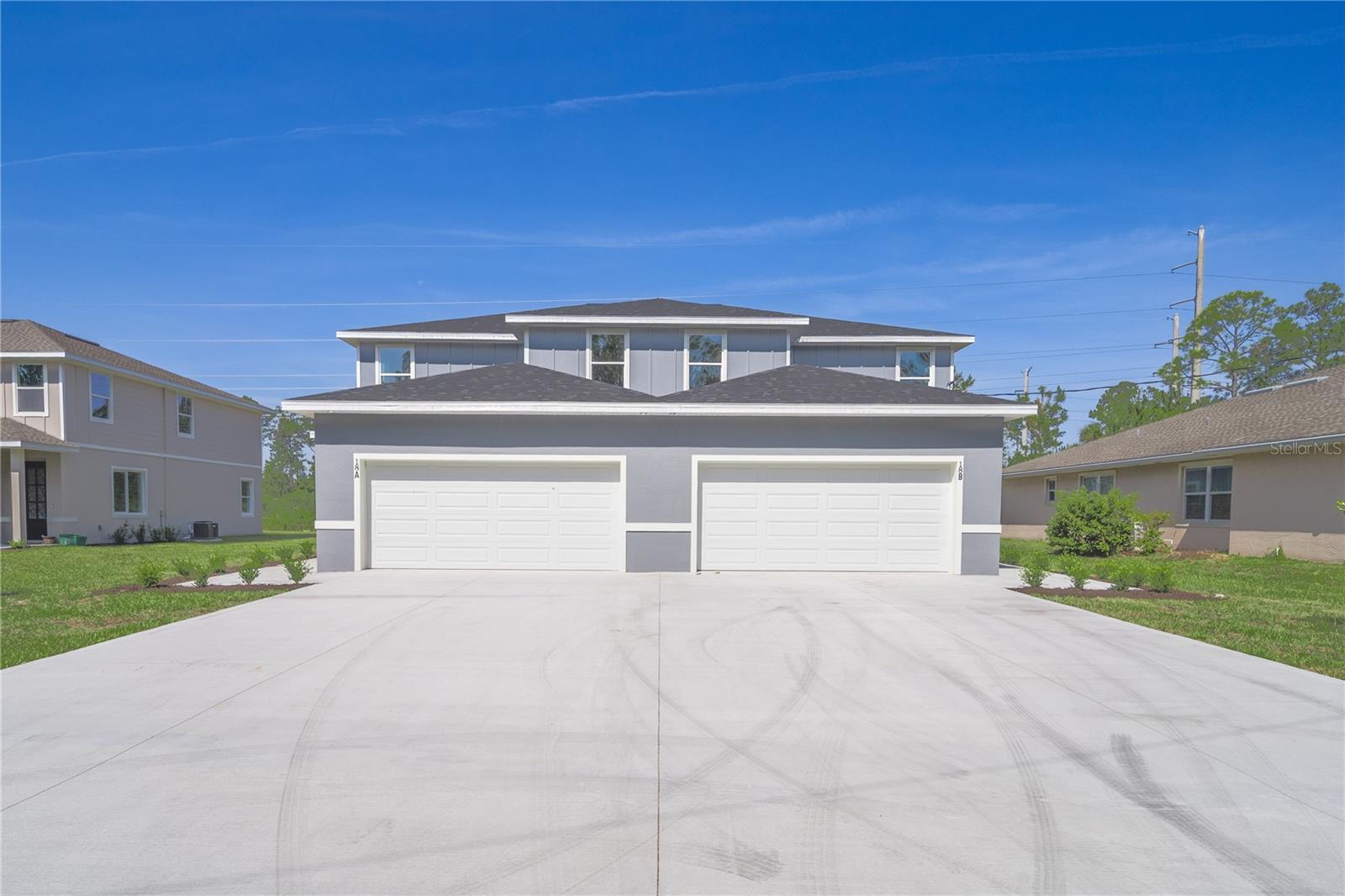 Discover this stunning newly built duplex, offering 2,085 sq. ft. of luxurious living space. Each spacious unit features 3 oversized bedrooms and 2.5 baths, designed with high-end finishes throughout. Whether you're looking to live in one side and rent the other, maximize investment potential, or complete a 1031 exchange, this property is an unbeatable opportunity!
The custom-designed kitchens boast stainless steel appliances, flowing seamlessly into expansive living areas and dedicated dining spaces—perfect for entertaining. Upstairs, the master suite impresses with a tray ceiling, a spa-like en-suite bath, and a generous walk-in closet. The additional guest bedrooms are equally spacious, sharing a stylish second bath.
Step outside to enjoy the large covered porch, ideal for relaxation or gatherings. With estimated rental income of $2,100 per unit ($4,200 total per duplex) offers exceptional income potential.
Located just minutes from major roads, shopping, dining, and the beautiful Flagler Beach, this home is also surrounded by scenic biking and hiking trails, offering the perfect blend of convenience and outdoor adventure.
Don't miss this rare investment opportunity—schedule your showing today!