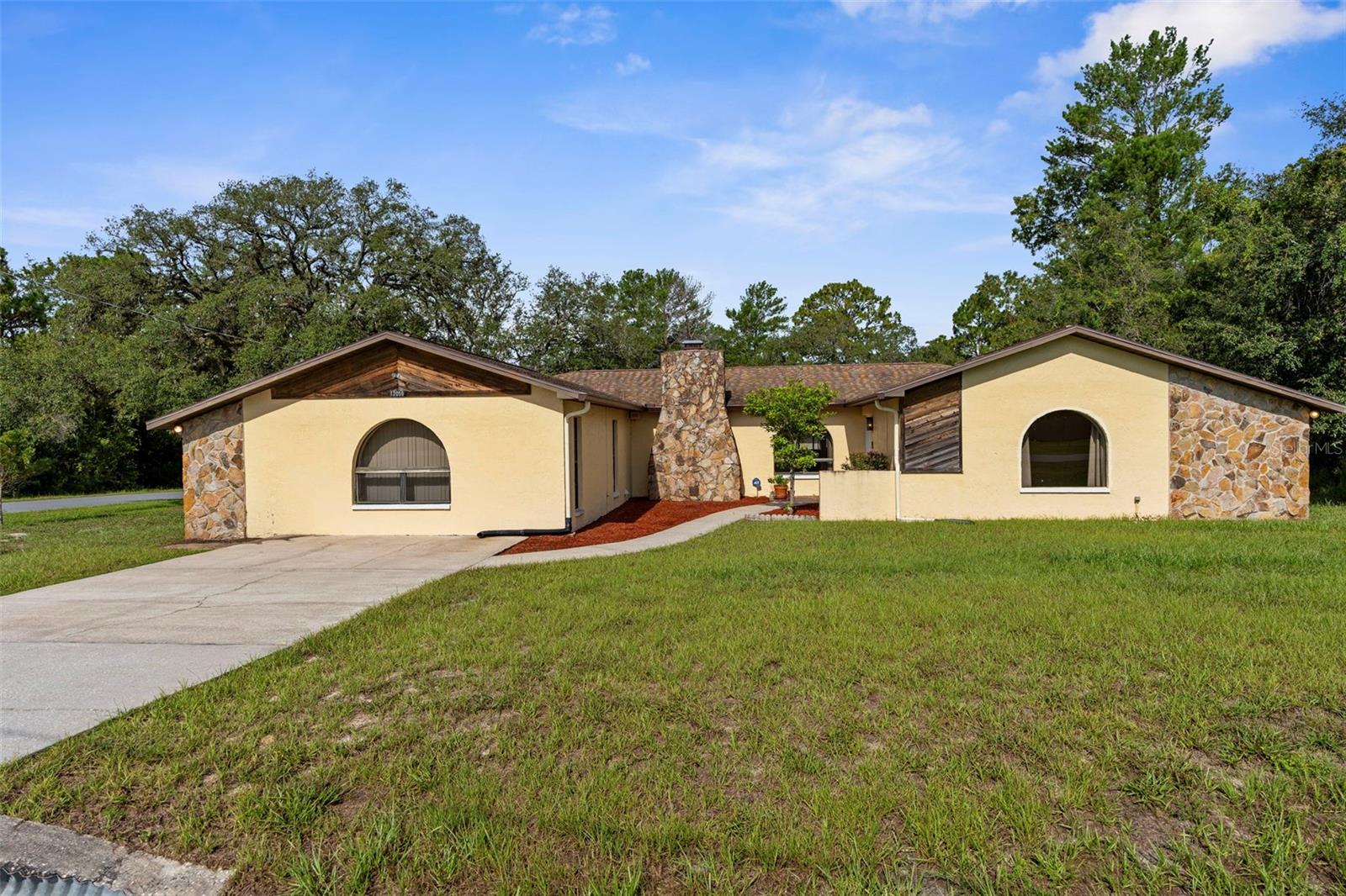 Discover this stunning 4-bedroom, 2-bathroom pool home with a versatile entertainment room, perfect for hosting gatherings or enjoying as an additional living area, located in the highly desirable Royal Highlands community of Hernando County. Sitting on a spacious 0.40-acre lot, this 2,386 sq ft residence offers a rare 4-car garage, ideal for extra vehicles, storage, or a workshop. Enjoy a split floor plan with tile floors, brand-new carpet in the bedrooms and family room, a cozy fireplace, and two new hurricane-rated sliding glass doors. Recent updates include an upgraded secondary bathroom, a 2018 roof on the garage, and 2012 roof on the house, and new LeafGuard gutters around the home. The sparkling pool is perfect for Florida living, while the separate detached garage adds unmatched flexibility. Close to Weeki Wachee Springs State Park, shopping, dining, and just minutes from Citrus County. Don't miss the chance to own a move-in-ready home in a sought-after location!