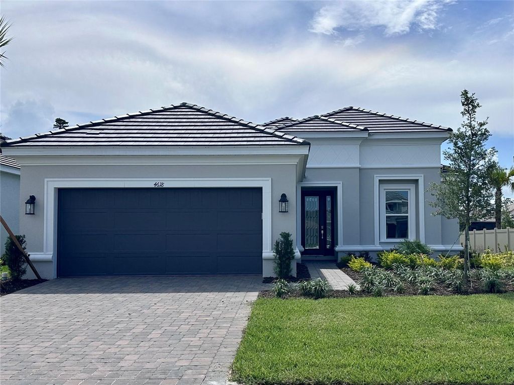 Photo of 4618 Isonzo Way, Wesley Chapel, FL 33543 (MLS # J990189)