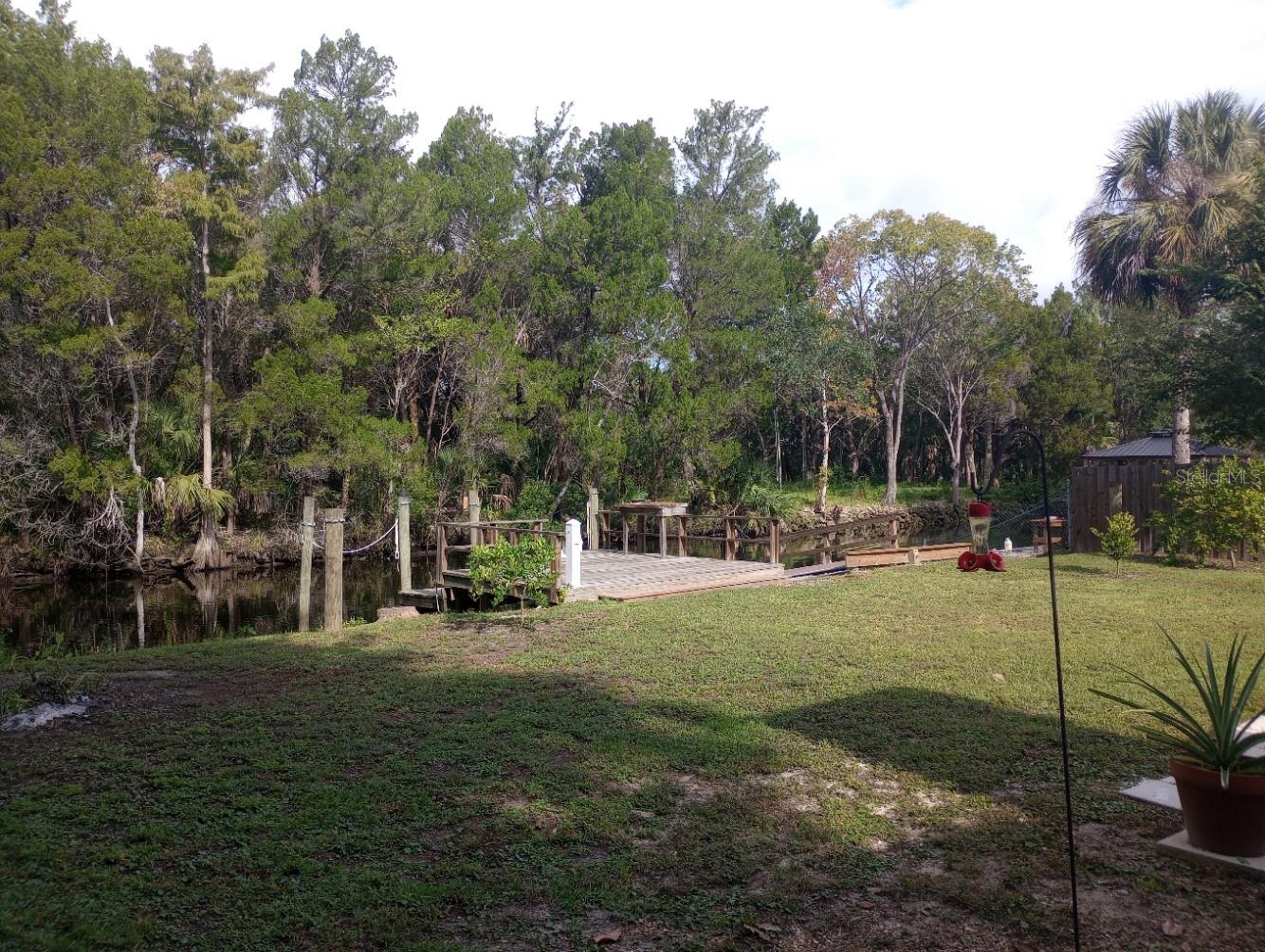 Comfortable and clean WATERFRONT home! Great fishing and protected deeper dockage with a 30A power pedestal. Bring your sailboat! 30A RV hookup. Fruit trees. Perfect floor plan with a pet friendly 3-season room. New shower and tile. Hardie board walls. Fireplace in the living area.