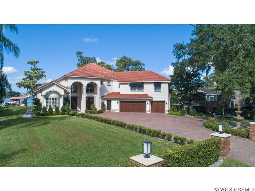 PRICE REDUCED FOR QUICK SALE! LIVE YOUR DREAM ON THE BUTLER CHAIN OF LAKES! One-of-a-kind resort style living awaits for the most discriminating of buyers on 200 feet of lake frontage on Wauseon Bay, in the quaint town of Windermere. Walking distance to Windermere Elementary! Offered for the first time, this custom estate is casually elegant and exquisitely finished with modern updates and every imaginable amenity such as Crestron full house automation to allow for comfort and convenience. Built specifically to capture the amazing lake and sunset views from virtually every room! An impressive entry with volume ceilings welcomes and is flanked by an expansive formal dining room and sunlit formal living room, overlooking the pool and waterfront. The first floor master suite features a large sitting area overlooking the water, morning bar, custom closet and spa-like retreat, with updated vanities and an enormous shower with rain heads. An open family room, office and chef's kitchen, with large granite island, light cabinetry, and upgraded appliances, including a Thermador gas cooktop, provide incredible views of the water at every turn. The second floor features 4 generous sized bedrooms and a state-of-the-art theater with seating for 9. Year round, enjoy endless sunshine from the the multitude of outdoor entertaining areas, the oversized saltwater pool or the private dock, featuring power boat cover, electric boat lifts, and jet ski dock for 4 with power drip. Why wait...come start living your dream today.