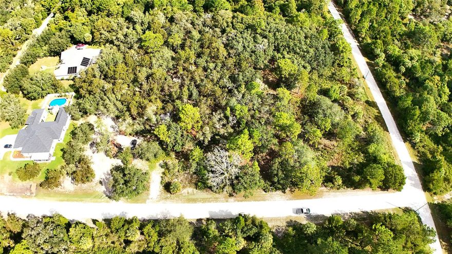 This 1.2-acre R1C-zoned lot gives you the opportunity to design and build your custom dream home—without the hassle of an HOA or deed restrictions. Whether you’re planning your forever home or securing a smart investment, this property offers endless potential. Set against a peaceful retention area, the lot provides both privacy and natural beauty. Picture enjoying your morning coffee surrounded by towering trees and ending your day with tranquil sunset views—all from your own backyard.

Beyond the serenity, you’ll love the convenience: close to shopping, schools, and major roadways, yet tucked away in a quiet neighborhood. Plus, you’re just a short drive to some of Florida’s best natural attractions—the sparkling Gulf of Mexico, Weeki Wachee Springs State Park, and countless trails, rivers, and outdoor adventures. Whether you’re ready to build now or hold for the future, this property is a rare find in a growing area. Don’t miss the chance to create your dream lifestyle in Royal Highlands—your perfect slice of Florida is waiting!