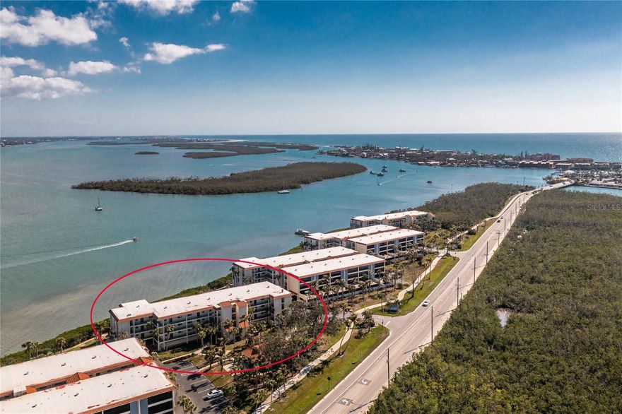 Beautiful Waterfront 4th Floor 2/2 Condo with 19' Florida Room, Side Balcony and Elevator being sold Turnkey! Located less than a mile from the Gulf, enjoy the quaint lifestyle and extraordinary views of Lemon Bay and the Intercoastal at sunrise every day and bask in this majestic oasis as you watch dolphins, manatees and boaters go by.  Open balcony has a waterview too and perfect to view a sunset over the Gulf.  Kitchen upgraded with backsplash, granite countertops, recessed lighting, and an Induction Stove with magnetic pans and pantry.  New Air Conditioner, upgraded doors, ceramic tile with carpet in living area and bedrooms and Washer and Dryer. Many extras such as twin Murphy Beds in Guest Bedroom to allow room for hobbies or office space. Computer, file cabinet, work table & lamp, golf clubs and many tools for minor maintenance also included. Extra locked closet in Primary's Walk In Closet. Hook up for Electric Vehicle Charger in garage parking space and conveniently located next to storage locker.  Note: Room measurements are approximate. Association has passed the State mandated MILESTONE STRUCTURAL INSPECTION and No Repairs were needed. Required Reserves have been established too!  Maintenance fees include water and cable. Condo amenities include elevator, covered garage parking, bicycle/kayak/SUP storage, garage storage locker for beach or fishing supplies, guest parking, gas grill areas, two heat/cool pools and a small dock for fishing. Clubhouse/Library with social activities and an on-site Rental Office available.  Enjoy a walk on a well maintained sidewalk to beautiful Englewood Beach and popular restaurants on Manasota Key with two offering free shuttles to and from the condo! For boaters, there are 60 privately owned docks across the road usually available to purchase or rent. Amazing views and location! - Don't miss this one of a kind!