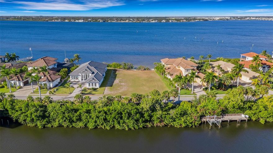 A Rare Waterfront Opportunity on the Manatee River – Hawk Island, Bradenton
Presenting one of the most extraordinary waterfront homesites available on the Manatee River. Set within the gated peninsula of Hawk Island, this over half acre vacant lot delivers unmatched privacy, prestige, and the freedom to create a true custom riverfront estate.
With 110 feet of pristine sand shoreline, the property offers sweeping, unobstructed views of the Manatee River—an ideal canvas for a luxury residence designed by the builder of your choice. Across the street, a deeded parcel on canal provides exceptional versatility, including the ability to construct a dock capable of accommodating substantial vessels. Owners may also choose to build an additional dock directly on the river, creating a rare dual waterfront lifestyle with unparalleled boating convenience.
For boating enthusiasts, this location is nothing short of exceptional. Enjoy clear, unobstructed access to the Gulf of Mexico, the Intracoastal Waterway, and world class fishing grounds. Cruise to a wide array of waterfront dining destinations or spend the day exploring the turquoise waters surrounding Anna Maria Island, Longboat Key, and Sarasota, all just a short and scenic ride away.
This property offers a clean slate—a rare opportunity to design and build a custom estate that fully embraces the beauty, serenity, and recreational lifestyle of the Manatee River. Hawk Island’s gated setting, limited number of luxury homes, and unmatched waterfront orientation make this one of Bradenton’s most coveted addresses.
A truly exceptional offering for the discerning buyer seeking space, privacy, water access, and breathtaking riverfront views.