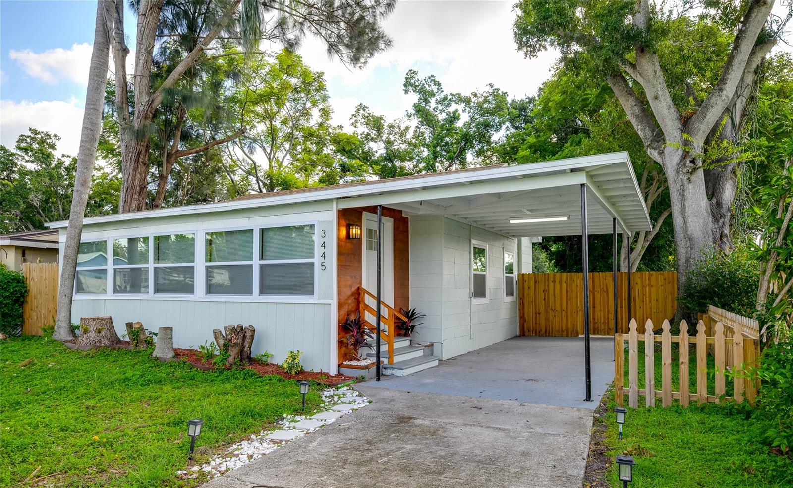 ST. PETE CHARM FEATURED WITH THIS BEAUTIFUL HOME - NO FLOODING & NON FLOOD ZONE PROPERTY - Sitting on an over 6000 sqft lot, with private access. Beautifully designed throughout, upon entry, you will find plenty of beautiful sunlight pouring through the NEW WINDOWS - to your right is the living room with beautiful accents and features, past the living is the kitchen featuring new cabinets, quartz countertops, stainless steel appliances, new fixtures throughout & a perfectly sized bar - perfect for working from home or a quick meal - and past the kitchen is perfect dining area, also featuring a new light fixture. Past the living room, you will find to your right the first bedroom, perfectly sized and with double 24" closets - and past this bedroom is the hallway full bath, featuring new tile, commode, vanity, and fixtures throughout. Down the hallway to your left is the 2nd perfectly sized bedroom, featuring double 24" closets as well. At the end of the hallway is the ensuite master bedroom - featuring a full ensuite bathroom, also finished with new tile throughout, a new vanity, commode, and plumbing/light fixtures. The third bedroom features a separate entry, perfect for an owners-suite/in-law suite/rental unit (there is a laundry hookup in the hallway, and outside as well if you want to make this a rental.) This home has an amazing back yard, with a storage shed, and plenty of space, perfect for those fall nights to relax and enjoy with family and friends! This home has an only 8 year old roof, as well as a newer AC, and new windows throughout!! Come see this beautiful home today!