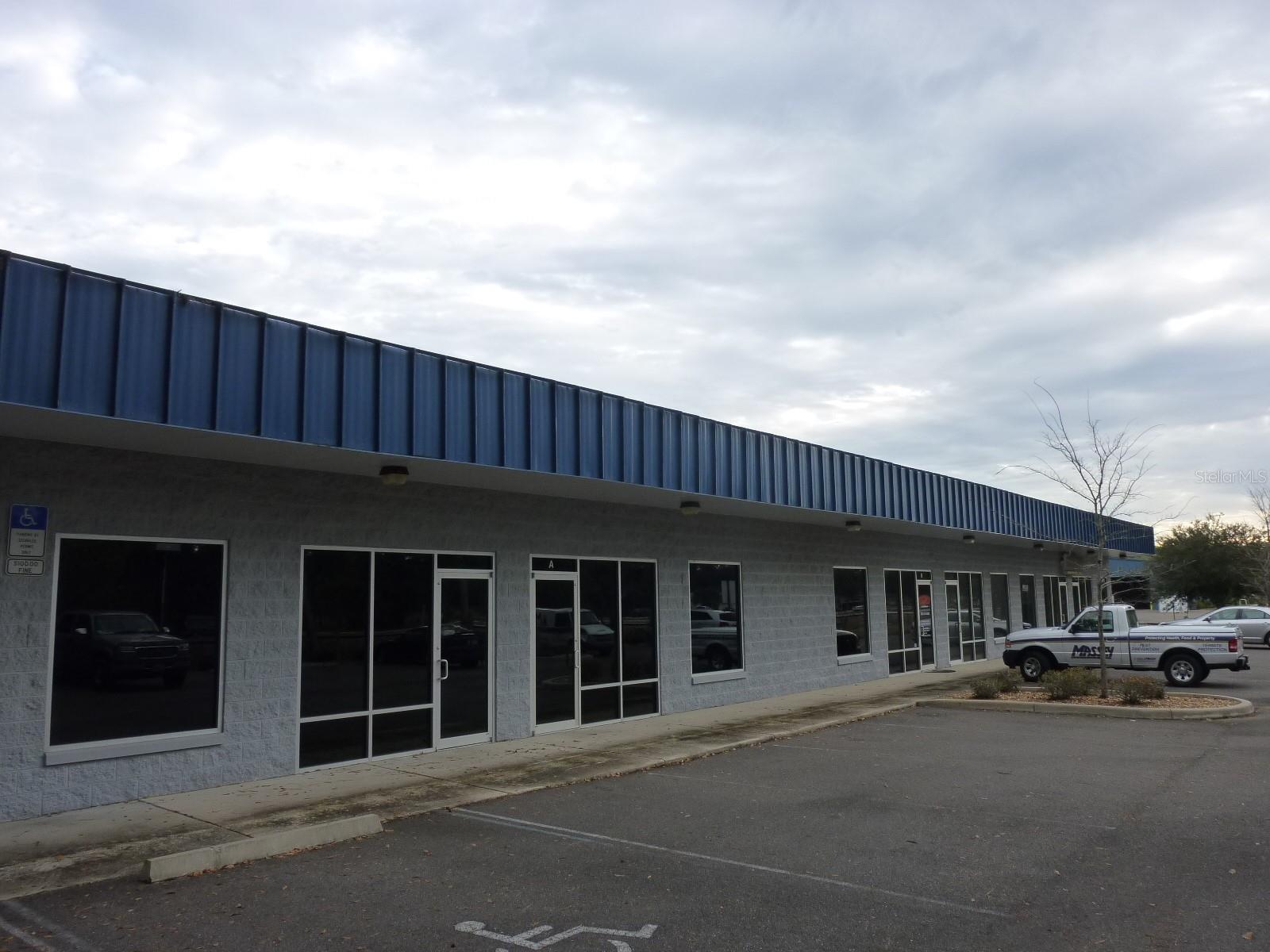 This spacious office/warehouse space has frontage on NW 13th Street in NW Gainesville. This floor plan has been a favorite among small businesses who want a professional curbside presence coupled with the added utility of warehouse space.
Suite B features approximately 350 SF of warehouse space, a 10x10 bay door, and approximately 1,350 SF of air conditioned office space with two private offices, a generous high-ceiling reception area, admin area, and a highly sought-after, spacious mezzanine. Suite B is currently occupied - all showings must be coordinated. Lease rate is NN and based on a 5 year term.