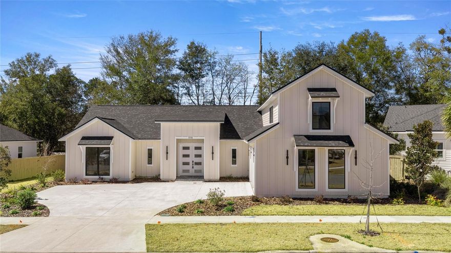 This newly completed custom home (2026) is ready for immediate occupancy. Designed in a modern-transitional style, the residence showcases clean architectural lines, expansive windows, and a blend of contemporary materials. A dramatic double-door entry introduces the refined interior, where soaring ceilings, designer finishes, and a chef-inspired kitchen create an atmosphere of relaxed luxury. The thoughtfully planned layout balances style with effortless everyday comfort, offering beautifully designed spaces throughout.

Oversized modern windows flood the home with natural light and frame views of the surrounding greenery, while the striking second-story window grouping above the garage adds architectural depth and curb appeal. With over 3,600 square feet of living space, the home includes a secondary foyer off the garage that leads into a spacious mudroom and an oversized laundry room with a dedicated wash sink.

The home offers 5 generous bedrooms and 3.5 baths, all finished in a neutral, modern palette. The chef’s kitchen is the heart of the home—vaulted ceilings, abundant counter space, soft-close cabinetry, quartz countertops and backsplashes, and a full suite of  LG appliances. Highlights include a 5-burner gas cooktop with a stove-mounted pot filler, a sleek LG Thin hood vent with professional-grade ventilation, and a built-in LG combination wall oven providing both premium convection and speed-oven cooking. A walk-in pantry and large breakfast bar open to the great room and dining area, creating an ideal setting for gatherings. Recessed lighting throughout adds a clean, modern finish.

The second level features a 20x14 fifth bedroom with its own den—perfect for an office, library, music room, or hobby space. The tri-split floor plan offers excellent privacy and flexibility, making it well-suited for multigenerational living. Luxury vinyl flooring spans the main living areas and bedrooms, while the bathrooms feature modern porcelain tile. The primary suite is a serene retreat with vaulted ceilings, a spa-inspired bath, a walk-in shower with rain showerhead, a freestanding soaking tub, and a spacious 13x6 walk-in closet.

Outdoor living is equally inviting with a covered patio, recessed lighting, —perfect for summer barbecues. The side-loading two-car garage includes additional under-stair storage. Step into a modern and elegant lifestyle—this home is a must-see.

Gloria’s Way is a charming neighborhood with tree-lined streets, sidewalks, and streetlights, located just 1.5 miles from Tioga Town Center for convenient shopping, dining, and recreation. Top-rated schools and easy access to I-75 make this an exceptional location. With its picturesque surroundings and thoughtful design, this home offers the perfect blend of comfort, style, and functionality for today’s modern living. Call today to schedule your private viewing.