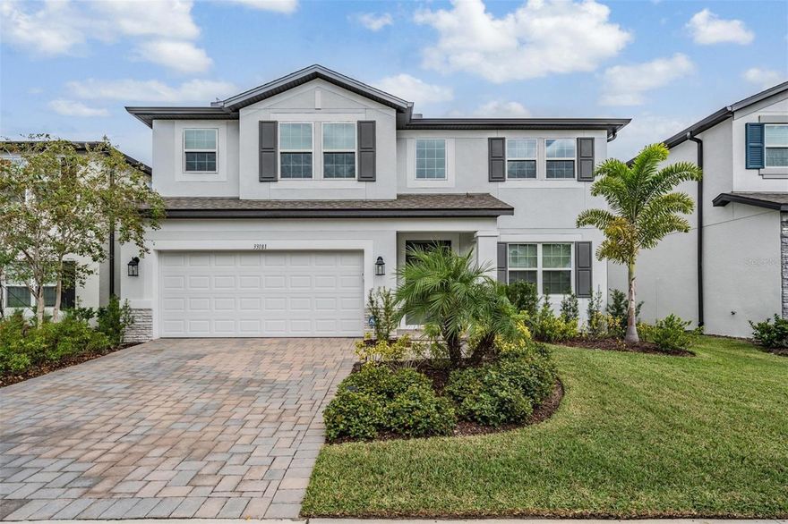 Welcome to 33181 Rosewood Bark Way a rare gem in the heart of Wesley Chapel. Step inside this stunning 5 bedroom, 5 bathroom residence with 2 primary suites and prepare to fall in love with one of the most flexible and sought after floor plans. From the moment you enter, the home greets you with a sense of warmth, sophistication, and space, a perfect blend of thoughtful design and elevated living. The main level features a dedicated home office space and a primary suite that feels like a private retreat, complete with a spacious en-suite bath and large walk in closet. The open concept great room invites gatherings large and small, with beautiful finishes, high ceilings, and natural light that fills every corner. The gourmet kitchen takes center stage with upgraded cabinetry, quartz countertops, stainless appliances, a large island that’s perfect for entertaining or casual meals and a walk in pantry with an adjacent butlers pantry. Upstairs, you’ll find the second primary suite an ideal setup for multi-generational living or extended guests. This luxurious space includes a spa inspired bathroom with a free standing soaking tub, glass shower, and double vanities, offering a serene escape after a long day. The additional bedrooms are equally spacious and well appointed, providing comfort and privacy for everyone. The second floor of this home is anchored by a large open loft area perfect for game nights, media room, or endless possibilities. Throughout the home, no expense has been spared, from premium flooring and designer lighting to the custom finishes that make every room feel special. Whether you’re hosting holidays, working from home, or welcoming out of town guests, this floor plan adapts effortlessly to your lifestyle. Outside, you’ll find a spacious yard and a covered screened in outdoor living space ready to be personalized, all within the highly desirable community of Whispering Pines, with NO CDD! Located just minutes from The Grove, Wiregrass Mall, and Tampa Premium Outlets, you’ll enjoy endless shopping, dining, and entertainment options. Major roadways and quick interstate access make commuting a breeze, and you will appreciate the top rated schools and convenient access to hospitals and health care providers. This home checks every box...luxury, flexibility, and location, all in one incredible property, it’s the lifestyle you’ve been dreaming of. Schedule your private showing today.
