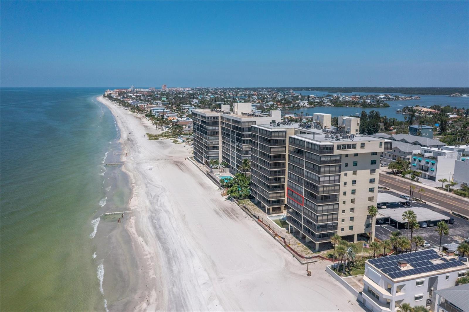 Escape to Paradise: Stunning Gulf-Front Corner Unit at Shores of Madeira. Your Perfect Beach Getaway Awaits on Madeira Beach's Sugar-White Sands. Experience the ultimate beachfront vacation in this updated 2-bedroom, 2-bathroom corner unit with breathtaking direct Gulf views from every room. Located in the boutique 48-unit Shores of Madeira condominium, this exceptional rental offers the perfect blend of luxury, comfort, and that coveted beach-life tranquility you've been craving for your getaway. What truly makes your stay unforgettable is the magnificent wrap-around balcony showcasing endless Gulf vistas, where floor-to-ceiling windows flood your vacation home with natural light throughout the day. The corner unit positioning ensures maximum privacy and panoramic views that extend far beyond what photographs can capture. There's something magical about falling asleep to the gentle sound of waves and waking up each morning to spectacular sunrises that paint the sky in brilliant colors right outside your window. Your vacation comfort is enhanced by the thoughtful layout throughout that creates perfect harmony between style and beach living practicality. Luxury vinyl plank flooring feels wonderful underfoot while easily handling sandy feet and wet swimsuits after your beach adventures. The intelligently redesigned kitchen provides everything you need for preparing morning coffee, beach picnics, or sunset dinners, with ample space for the whole family to gather. A rare convenience in beachfront rentals, the full-size laundry room means you can pack light and keep your resort wardrobe fresh throughout your stay. An abundant closet and storage space ensures everyone's belongings have a place, keeping your temporary home organized and comfortable. The Shores of Madeira community enhances your beach life with amenities that make every day feel special.The casual cozy club room is perfect for family game nights or socializing with others. While beach toy storage means less packing. The secure building's lobby adds to the upscale experience. Your included covered parking space eliminates beach area parking frustrations, ensuring your convenience is always prioritized. No circling for spots or worrying about your vehicle while you're relaxing on the beach.
Your beachfront location means stepping directly onto Madeira Beach's famous soft, sugar-white sand right from your building. No crowded beach access points or long walks with beach gear—your perfect beach day starts just steps from your door. The vibrant entertainment and dining scene at nearby John's Pass becomes your personal playground, easily accessible by the complimentary Beach Ride shuttle or a pleasant evening stroll along the pristine shoreline. From waterfront restaurants serving the freshest Gulf seafood to live music venues and unique shopping experiences, you'll have endless entertainment options throughout your stay. This isn't just another vacation rental—it's your gateway to experiencing the authentic beach lifestyle where every single day of your stay feels like pure escape from everyday life. Whether you're planning a romantic getaway, family vacation, or friends' retreat, this Gulf-front paradise offers the perfect setting for creating memories that will last long after your tan fades. Book your stay today and discover why guests return year after year to experience the magic of beachfront living at Shores of Madeira.