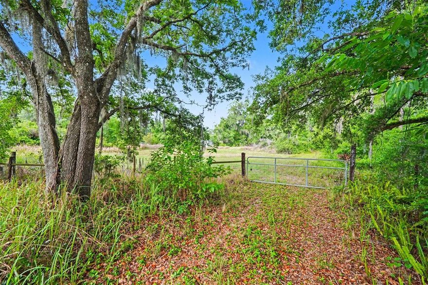 Rare opportunity to own 7.55 acres in fast-growing Plant City with three separate parcels being sold together for one price. Zoned AS-1 (approximately 1 home per acre), this property is ideal for a builder, investor, family compound, or anyone looking for space, privacy, and future potential.

The property includes:
• 4103 Stanley Rd — 1.08 acres with well, septic, and electric already in place, saving substantial money on future development costs and impact fees. This parcel is fenced, has road frontage, and includes the entrance easement providing access to the additional parcels (approximately 50 feet wide by 585 feet long).

• Center Parcel — 5.47 acres of open pasture land ready for your vision. Approximately 1.08 acres toward the rear may be considered low-lying/wetland area (buyer to verify). Zoned AS-1, allowing the potential for up to 5 homesites (buyer to verify), making this an excellent opportunity for development, a private estate, or a multi-home setup.

• 4107 Stanley Rd — additional 1-acre parcel featuring an older mobile home with existing well, septic, electric, and impact fees already paid, creating added value and savings for future improvements or replacement.

This unique property offers endless possibilities for a private estate, multigenerational family compound, or multiple homesites. No HOA restrictions — bring your boats, RVs, animals, workshops, and more. Not located in a flood zone.

Conveniently located near I-4 with easy access to Tampa and Orlando while still enjoying a peaceful country setting.

Properties offering this much land, flexibility, and existing infrastructure are becoming increasingly difficult to find in Plant City. Buyer to verify zoning, buildability, wetlands, easements, and all county requirements.