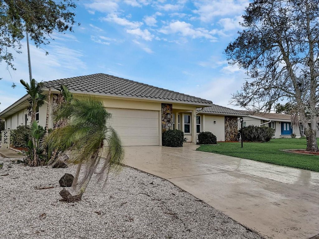Photo of 10 Stone Mountain Boulevard, Englewood, FL 34223 (MLS # A4676254)