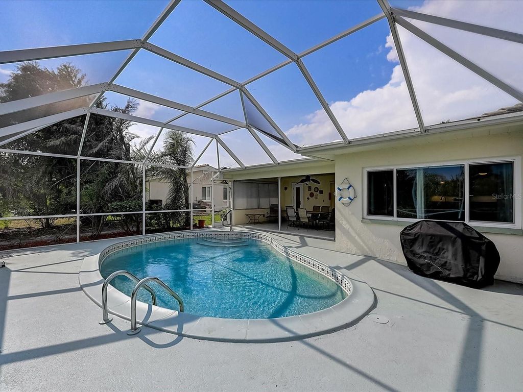 Photo of 10 Stone Mountain Boulevard, Englewood, FL 34223 (MLS # A4676254)