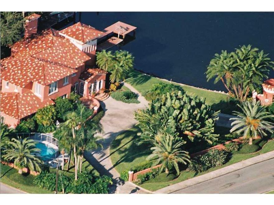 Snell Isle's  mediterranean landmark home on Brightwaters, sets the stage for the area with its beautiful architectural presence and curb appeal. Located on a double lot,(with 146 ft on the waterfront) it has  expansive lawns for entertaining,a large pool, dock, patios, decks & tropical landscaping. This immaculate home, called "Villa Tramonta Rosa," features high ceilings, spacious rooms, stucco walls, gleaming hardwoods, a marble fireplace, custom double pane windows & doors,  tall arches, columns, tile roof, private vistas & walkways & meticulous craftsmanship throughout. This home is rich in architectural history and noted for its clean lined restorations that focus on the natural light and textures, A one-of-a-kind location. Wonderful views. A classic  beauty on the island,  Walk & bike downtown to restaurants, galleries , museums and events. 25 minutes to Tampa International Airport and the beaches. A Snell Isle beauty that is featured for its remarkable architectural style  and history in two hardcover coffee-table books.