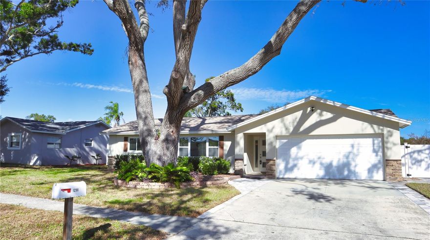 Located in the highly desirable Oakhurst Acres neighborhood, this completely updated 3-bedroom, 2-bath home sits on a corner lot with a new roof (2023), HVAC (2023), tankless water heater (2023), and replacement windows throughout. Conveniently located near Seminole Town Center and just 7 minutes from Indian Shores Beach, this home has been remodeled from top to bottom. Luxury vinyl flooring flows throughout, and the open-concept kitchen features white cabinets, granite countertops, and stainless steel appliances under two years old, with a massive island perfect for entertaining.

Behind the kitchen, you’ll find an additional living or dining area and the master suite with a beautifully tiled ensuite shower. Off the main living area are two spacious bedrooms and another elegantly tiled bathroom. The home also offers an irrigation system on well water to save on utility costs, a two-car garage, and a spacious backyard.

This property is not located in a flood zone or evacuation zone, making it a secure and worry-free choice. Truly move-in ready, giving you peace of mind from day one.