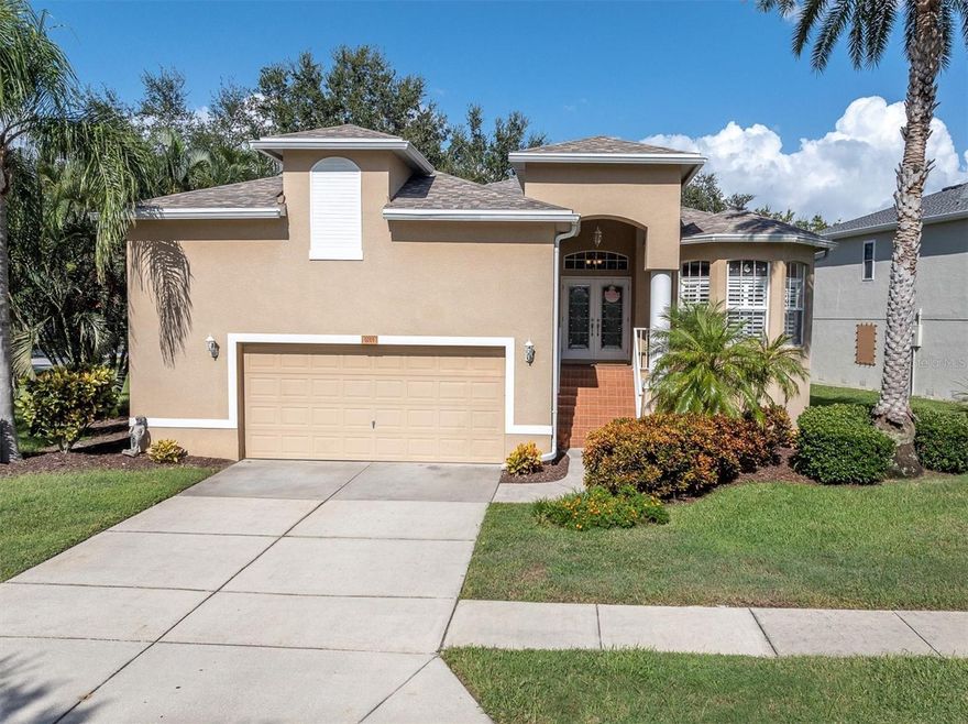 Welcome to your dream coastal home in the highly desirable Pointe Alexis South community of Tarpon Springs, Florida. This elevated 3-bedroom, 2-bathroom residence with an oversized 2-car garage sits on a beautifully landscaped corner lot with peaceful pond views and tropical surroundings. Step through the elegant double front doors into a light-filled open floor plan featuring hardwood floors, neutral paint tones, and plantation shutters throughout. An arched doorway leads into the gourmet kitchen, which offers granite countertops, stainless steel appliances, wood cabinetry, a breakfast bar, and a cozy eat-in dining nook—perfect for both everyday living and entertaining.
The spacious living and dining areas flow seamlessly and offer a comfortable, coastal-inspired layout. The primary suite is a private retreat with a luxurious en-suite bathroom including a jacuzzi tub and a professionally designed California walk-in closet. Two additional bedrooms provide ample space for guests or a home office. A screened-in patio at the rear of the home overlooks a tranquil pond, offering the ideal spot to relax and enjoy Florida's natural beauty. Additional features include a newer roof (2023), updated A/C (2019), and a transferable flood insurance policy at only $900 per year. Pointe Alexis South is a resort-style, maintenance-free community with HOA fee that covers water, sewer, trash, cable, internet, full lawn maintenace including tree trimming and sprinkler maintenance. Residents enjoy access to a newly renovated clubhouse featuring an Olympic-sized heated pool and spa, fitness center, billiards, library, large event space with kitchen, tennis, pickleball, and shuffleboard courts. Located just minutes from Fred Howard Park, Sunset Beach, the Pinellas Trail, Downtown Tarpon Springs, and the historic Sponge Docks. Don’t miss this rare opportunity to own a move-in-ready coastal oasis in one of Tarpon Springs’ most sought-after communities. Must see to appreciate! Schedule your showing today!