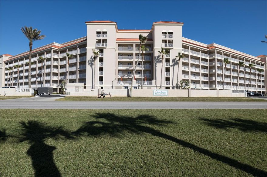 Rare, unique north corner unit at Sandpiper Condo.  Beautifully decorated coastal decor through out this spacious three bedroom, three bath oceanfront condo located on the no drive beach.  Spectacular ocean views through 2 sets of north facing windows, from the kitchen, dining room and full set of sliding glass doors lead out from the living room to the oceanfront wrap around private balcony. Two of the three bedrooms are oceanfront.  Primary bedroom has it's own private oceanfront balcony, on suite with jetted tub and custom walk in closet.  Bedroom number two is also oceanfront, third bedroom faces west.  Too many upgrades to mention!! Sandpiper complex amenities include seawall, two geothermal oceanfront pools and kiddie pools, tennis and pickleball court and 7th floor clubhouse.  Move in ready and fully furnished ready to be your dream condo.
