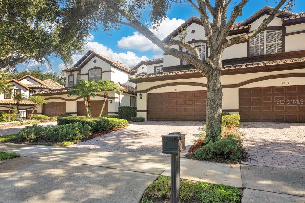 Ready for immediate occupancy! Welcome home to your extraordinary townhome on a quiet cul-de-sac in the 24-hour guard gated community of Vizcaya. Enjoy the carefree lifestyle in this elegant home with no rear neighbors, volume ceilings, crown molding, and upgraded flooring throughout. On the main level you will find plenty of entertaining areas including a spacious great room with soaring ceilings. Kitchen is well appointed with stainless steel appliances, 42” wood cabinets, solid counters, pantry and a dining nook. The main level primary suite is spacious with a walk-in closet, upgraded bathroom with dual vanities, tub, and shower. The lanai is screened in with no rear neighbors. The entire second floor is adorned with rich wood floors. Upper-level loft is massive and can be used as additional flex space for an office/gym/media room. Secondary bedrooms are generously sized with one en-suite and the other with an adjacent full bathroom. Washer and Dryer are included in the rental. The community pool is just around the corner. Neighborhood amenities include a waterfront complex with a fitness gym, fishing dock, venue space, park, and a tennis court. Short distance to the famous “Restaurant Row”, world class golf courses, shopping, theme parks, and 25 minutes to the international airport. Truly a must see and won’t last long!