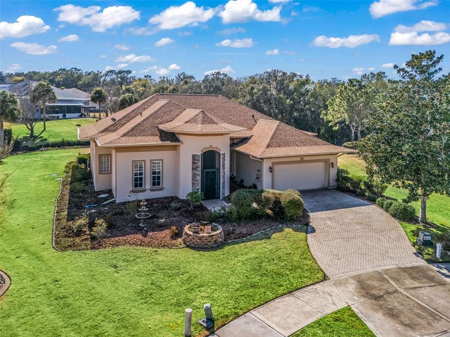 Welcome home! 8 ft doors, arched doorways, rounded corners, and soaring ceilings fill this home with Florida sunshine. The Great Room starts your tour with a generous dining area, a large seating area, and a view into the generously sized Florida Room with a beautifully landscaped yard. The kitchen is so functional with Corian countertops, a matching suite of appliances, 42-inch cabinets, and a delightful eating area with a closet pantry. Most of the floors in the home are easy-care ceramic tile or wood-look laminate for beauty and durability. Two bedrooms share a full bath on one side of the home, while the Primary bedroom (15 x 16) is located opposite and has soft beige carpeting, 2 walk-in closets, and a bay window facing the yard.  The Primary bath has 2 sinks and counters, a large walk-in shower, tile floors, a comfortable garden tub, and a linen closet. Don’t forget the office with French doors and a window facing the front of the home. A 2-car garage provides space for everyone. The pergola covering the patio at the back of the house is sure to be one of your favorite features. For your piece of mine, the Roof was replaced in May 2024, and the HVAC was replaced in August 2025.  Harbor Hills is an all-age, 24-hour guard-gated community situated on one of the highest elevations in Central Florida, and has a canal leading into Lake Griffin. It is close to shopping, hospitals, and entertainment. There is a Country Club, Golf, Tennis, Pool, Racquet Ball, Fitness Center, Boat Dock, Pickle Ball, and social clubs available for Club Members. Memberships are available separately. The Villages is approximately 8 minutes, Leesburg is 15 minutes, Ocala is 45 minutes, Disney World is 1 hour, and Tampa is 2 hours away from Harbor Hills. The home is in the state's center, giving easy access to both coasts.  (drapes in the Great Room do not convey)