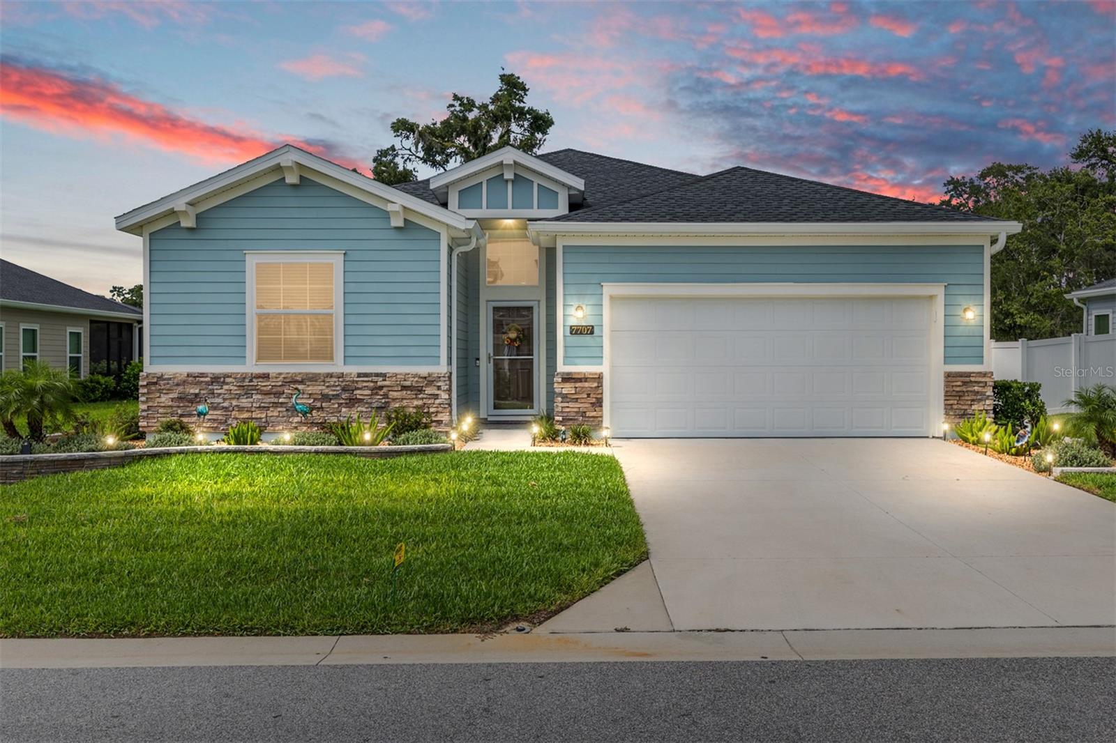 This meticulously maintained custom built Trevi model blends style, comfort, and functionality—perfect for those seeking elegant living in a new and vibrant 55+ community! Featuring 3 bedrooms, 3 bathrooms, and a versatile office/den- flex space with privacy doors. Located on a premium lot, with NO REAR NEIGHBORS and a fully fenced in backyard, this residence is truly ONE OF A KIND! Spanning 2,032 square feet, this home offers an open, spacious layout ideal for family living and entertaining. At the heart of the home is a beautiful chef's kitchen, featuring a large kitchen island, glistening granite countertops, custom solid wood cabinetry, stainless steel appliances, and ample cabinet space for all your culinary essentials. This expansive open-plan layout that seamlessly integrates living, dining, and kitchen spaces, perfect for entertaining. The primary suite is a true sanctuary, offering an ensuite bathroom with dual vanities, a beautifully oversized tiled stand-up shower with a sleek glass door and waterfall shower system, and two spacious walk-in closets with custom built-ins! The spacious second bedroom is perfect for guests, complete with a deep closet and a private ensuite featuring a shower/tub combo and a deep vanity. The third bedroom is equally impressive, bathed in natural light from a large window and equipped with a deep closet. Steps away, The versatile office/den space is perfect for those who work from home or can easily be converted to a fourth bedroom. Designed for indoor-outdoor living, beautiful large sliders invite you to a very private, oversized extended screened in lanai—a tranquil haven perfect for entertaining! Located on a private homesite that doesn’t back to other homes, you'll enjoy a serene retreat in your backyard. Enjoy access to the new covered pavilion, community pool, and recreational amenities, including bocce, pickleball, and shuffleboard—providing endless opportunities for leisure and connection. Conveniently located near restaurants, shopping, and just 15 minutes from the renowned World Equestrian Center, this home offers luxury, convenience, and community in one exceptional package. From its luxurious upgrades to its attention to detail, this home is a rare find that perfectly blends sophistication and comfort. Schedule your private tour today!