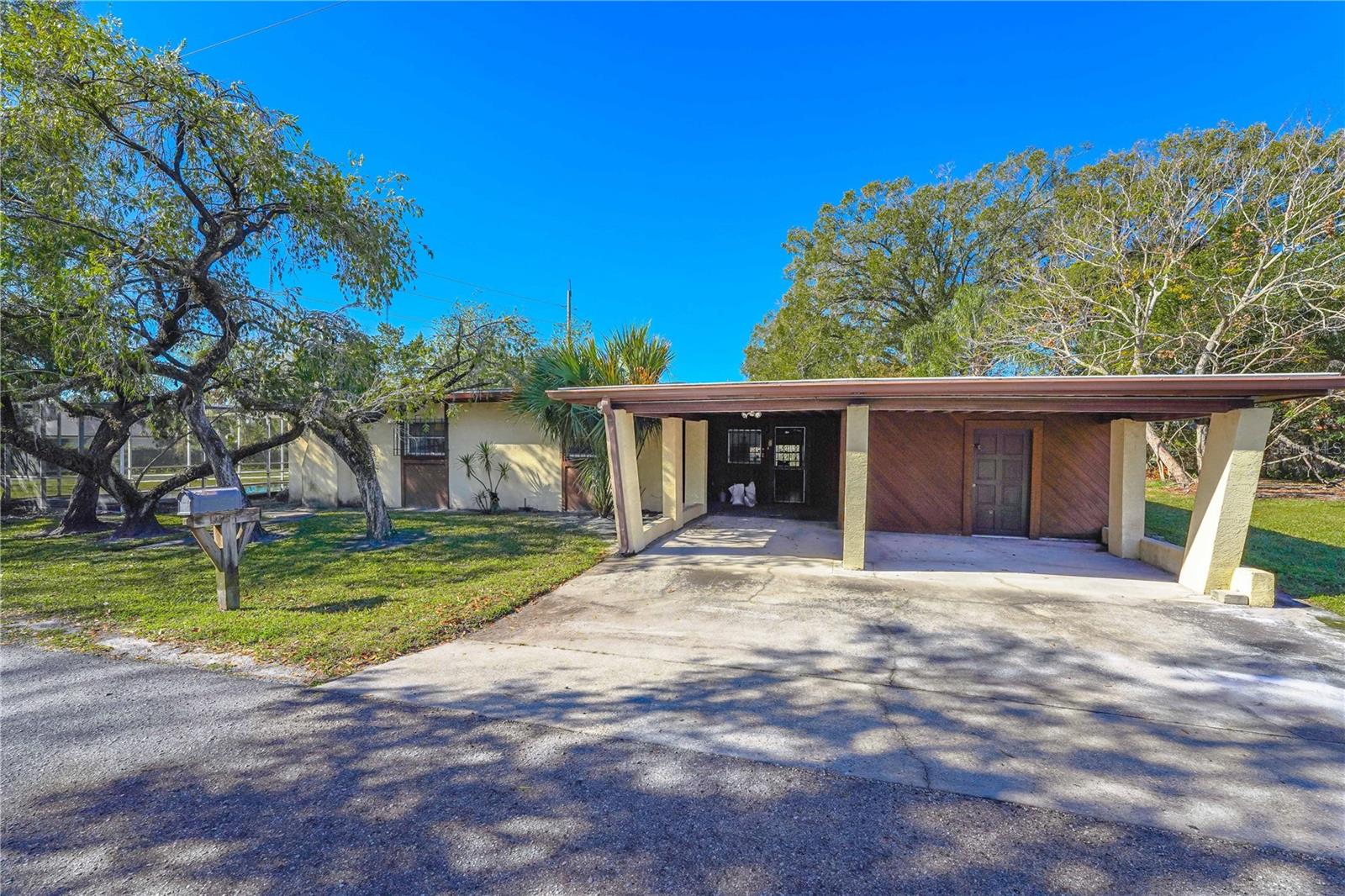 Location is key!!! Come take a look at this 3 bedroom, 1 1/2 bathroom home, with a separate laundry room, extra den/office space as well as a storage shed that could also be converted into heated living space. This Home could potentially offer over 2000 sqft of living space! There was a complete roof over in 2020; which comes with a transferable manufacturer's warranty, as well as workmanship warranty. All leaks in the pool were addressed and sealed in 2021. The inground pool, enclosed with a screened lanai is still being serviced weekly to this day. The Home will need lots of TLC, but with the right touch and vision this property could be everything you want and need! The property offers a corner lot totaling over a quarter acre of cleared buildable land, so many possibilities! Get your chance at a piece of North Tampa while the opportunity is available!! Just a walk away from Lake Carroll and conveniently located outside of downtown Tampa. The land has been approved by zoning and other county divisions for subdivision, if the buyer decides to complete the process! Check with zoning to see all of the possible income opportunities and confirm your building plans!! Survey and documents available upon request. Property could possibly be subject to probate, title work is in process.