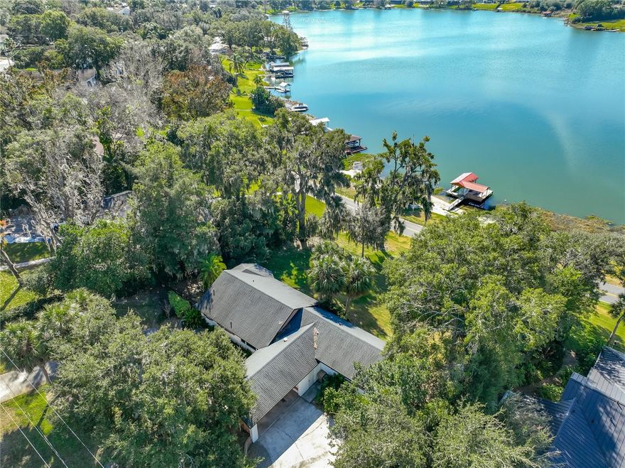 Come see this beautiful lakefront retreat perfectly positioned on the pristine shores of East Crooked Lake, where boating, fishing, water skiing, and endless waterfront enjoyment are right outside your door. This exceptional home captures breathtaking panoramic lake views and is thoughtfully designed for relaxed Florida living, featuring a covered boat lift for effortless days on the water and a private beach ideal for swimming, sunbathing, or gathering with family and friends. Inside, the home is filled with natural light and offers an inviting layout that maximizes views of the lake, making it perfect for both everyday living and entertaining. Located just minutes from charming downtown Mount Dora, you’ll enjoy easy access to boutique shopping, world-class dining, and a full calendar of popular festivals and events throughout the year. Whether you’re seeking a full-time residence, weekend getaway, or investment opportunity, this property delivers the ultimate lakefront lifestyle with unmatched scenery, recreation, and a highly desirable location. Call your Realtor for a showing today!