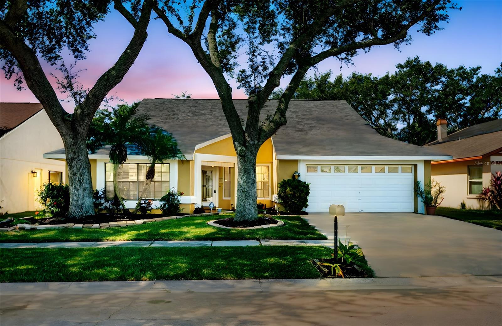 Welcome to this beautifully maintained, move-in ready home in the sought-after Pebble Creek community! Offering 4 bedrooms, 2 bathrooms, and over 2,000 sq ft, this spacious split-bedroom layout delivers the room and flexibility you’ve been looking for. A NEW shingle roof was installed in the end of 2021, giving you peace of mind for years to come! Soaring cathedral ceilings create an open, airy feel the moment you walk in. Durable laminate flooring runs through the living areas, primary bedroom and 2nd bedroom, with tile in the kitchen and baths for easy care, and recently steamed carpet in the other bedrooms. The private primary suite sits on its own wing and features a recently remodeled spa-style shower with new tile and fixtures, dual vanities and a spacious walk in closet. Three additional bedrooms on the opposite side of the home share an updated full bath with a new double vanity, and upgraded subway tile in the shower. Sliding doors open from your living room to a fully screened, covered patio—ideal for entertaining—overlooking a large, fully fenced backyard with a storage shed. Other updates include new interior plumbing with PEX piping (2024) and brand new insulation in the attic (2025). Pebble Creek keeps monthly costs low with an HOA of just $630 per year, NO CDD's, and amenities that include a community pool, playground, parks, tennis courts, clubhouse, and more. All of this in a prime location close to major highways, shopping, dining, entertainment, and top medical facilities—making daily living convenient and connected. With its recent updates, new roof and insulation, this home is truly move-in ready—schedule your private showing today!