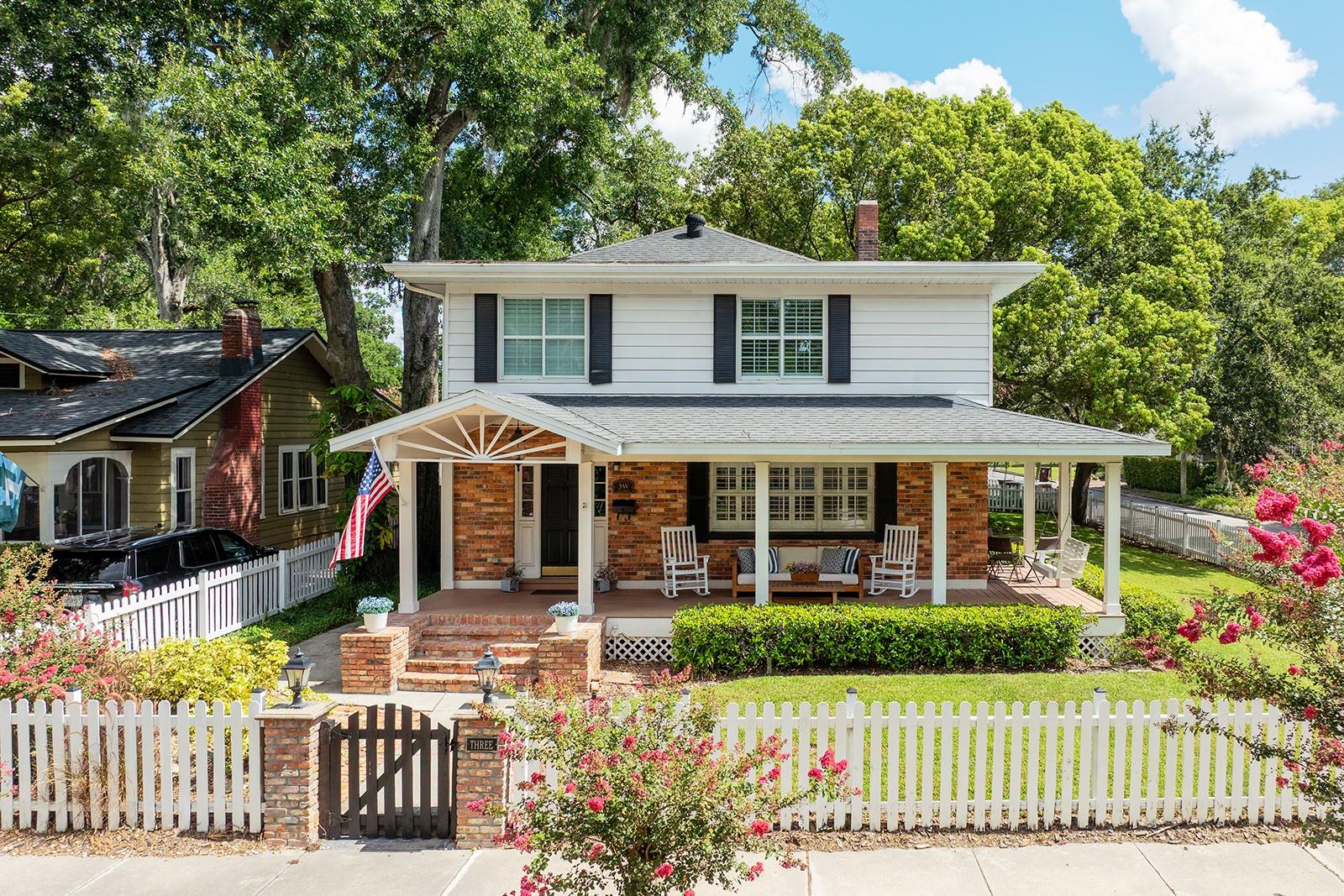 Welcome to this beautiful 3-bedroom, 2.5-bathroom home situated on a large corner lot, offering abundant living space inside and out. Located on one of College Park’s most desirable streets, an easy stroll from Lake Ivanhoe and the neighborhood’s shops and restaurants, this home features a beautiful combination of contemporary upgrades and original charm.
Step inside to discover an inviting floor plan featuring hardwood floors, high ceilings, and a wood-burning fireplace. Ample living space downstairs makes this home perfect for work, entertaining, or relaxing. The home’s living room connects to a dedicated den/office and opens to dining space flooded with natural light. The upgraded kitchen boasts white shaker cabinetry, quartz countertops, stainless steel appliances, and a center island. A hallway off the kitchen leads to a combination pantry and utility room and a second large family living space with newly installed LVP flooring and access to a screened patio.
Upstairs, you'll find all 3 bedrooms, including a flex space off the third bedroom—ideal for a playroom, nursery, or additional office. The primary suite features a fully upgraded en suite bathroom and a large walk-in closet. Recent improvements include upgraded electric and plumbing, an upstairs HVAC system replaced in 2023, and select new windows and flooring throughout the home.
Additional features include:
• 2-car garage
• Abundant storage, including a large storage room off the family room
• Wrap-around front porch and private back patio
• Updated systems and finishes throughout
