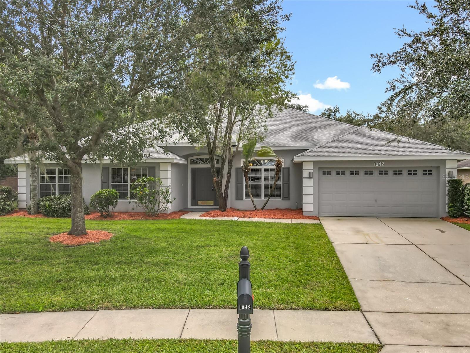 This property has been professionally staged. Welcome to this beautifully renovated 4-bedroom, 3-bath home with a 2-car garage, nestled in the desirable Chisholm Estates community! This stunning property features a brand new roof and extensive upgrades throughout, including a modern kitchen with Quartz countertops, soft-close cabinets, stainless steel appliances, an island, and a wine cooler. Enjoy new LPV flooring in the main living areas and cozy carpet in the bedrooms. Vaulted ceilings in the living and family rooms add a spacious feel, while the large primary suite boasts a tray ceiling, walk-in closet, and a spa-like bath with dual sinks, a garden tub, and an oversized shower with dual shower heads. Relax or entertain in the screened and covered patio. Conveniently located near Orlando, St. Cloud, Orlando International Airport, and Lake Nona Medical City. Don't miss your chance to own this move-in-ready gem-schedule your private showing today!